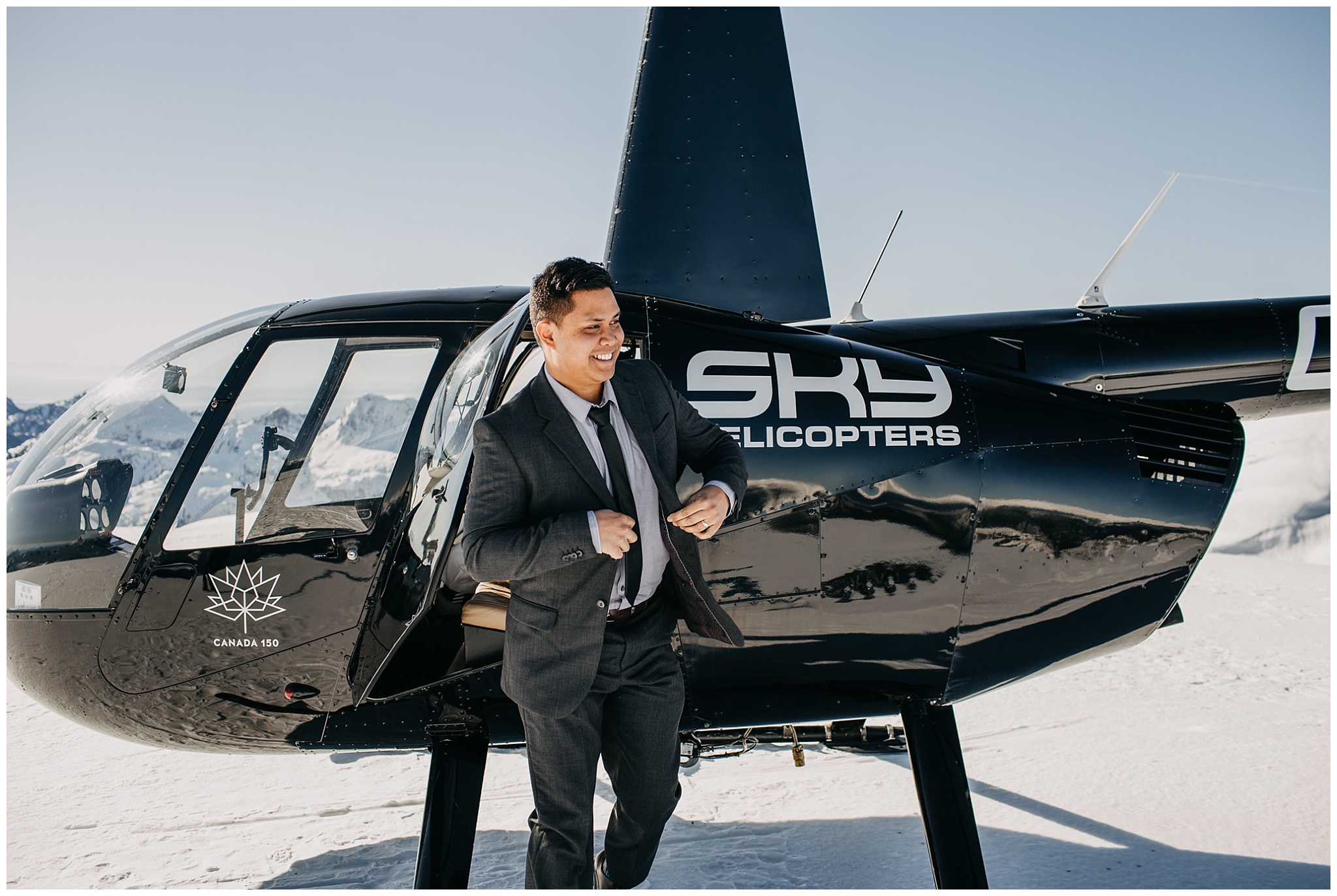 groom exiting sky helicopters snowy mountaintop wedding portraits