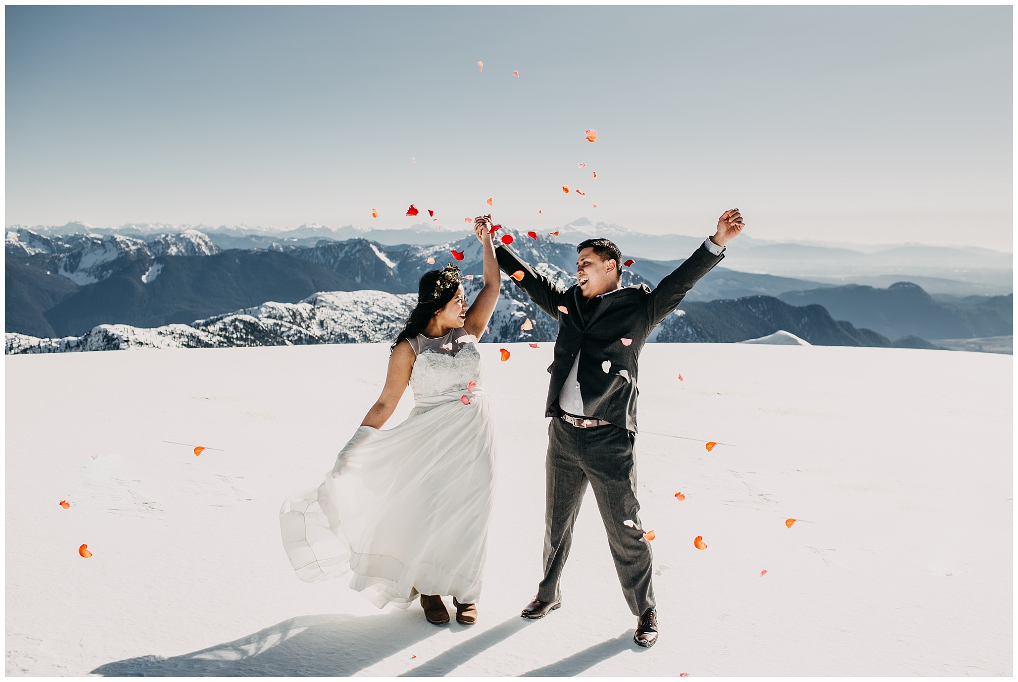 bride groom confetti mountaintop snow sky helicopters wedding cheer