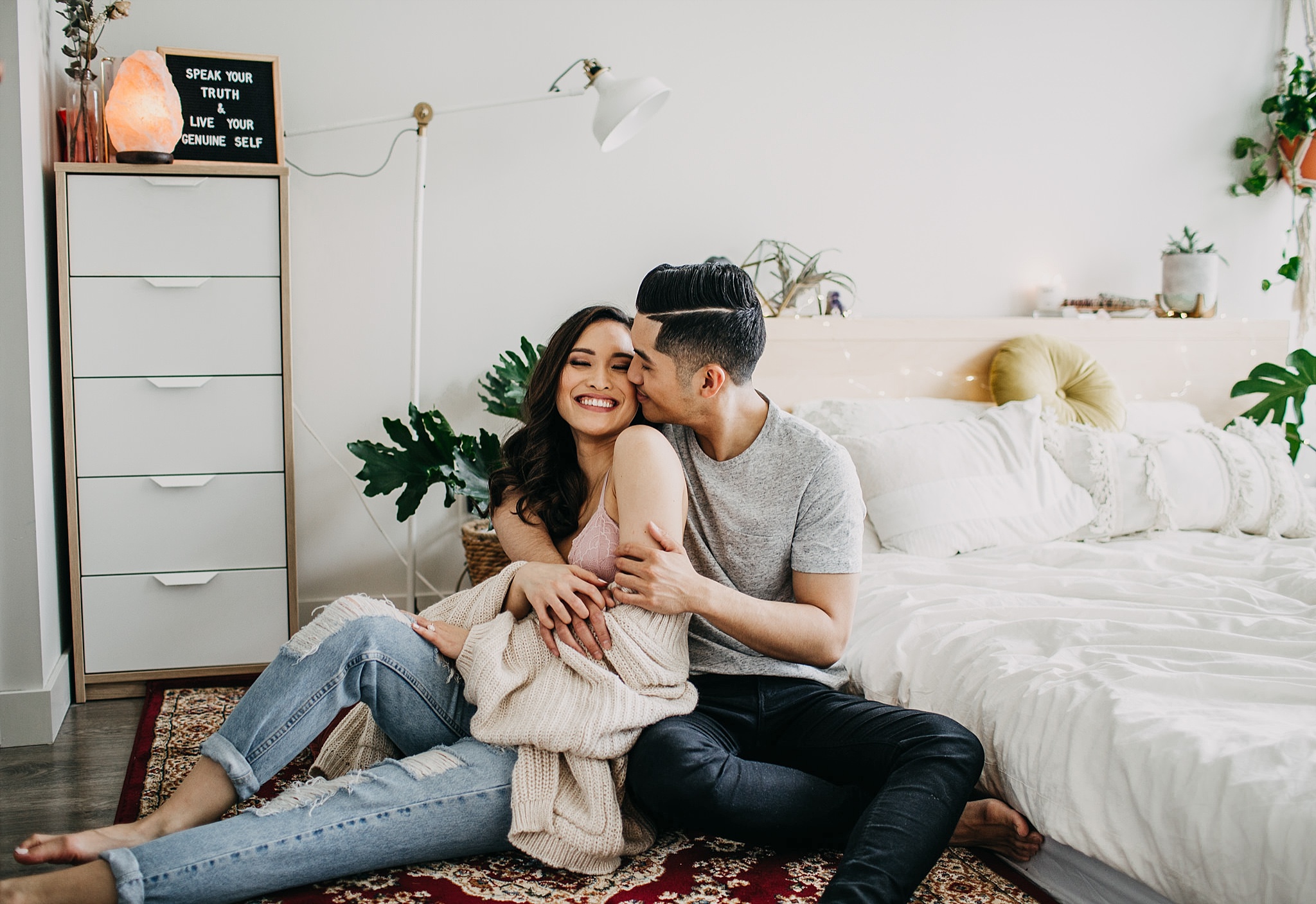 couple bedroom in home engagement session vancouver persian rug hanging plants home decor inspo