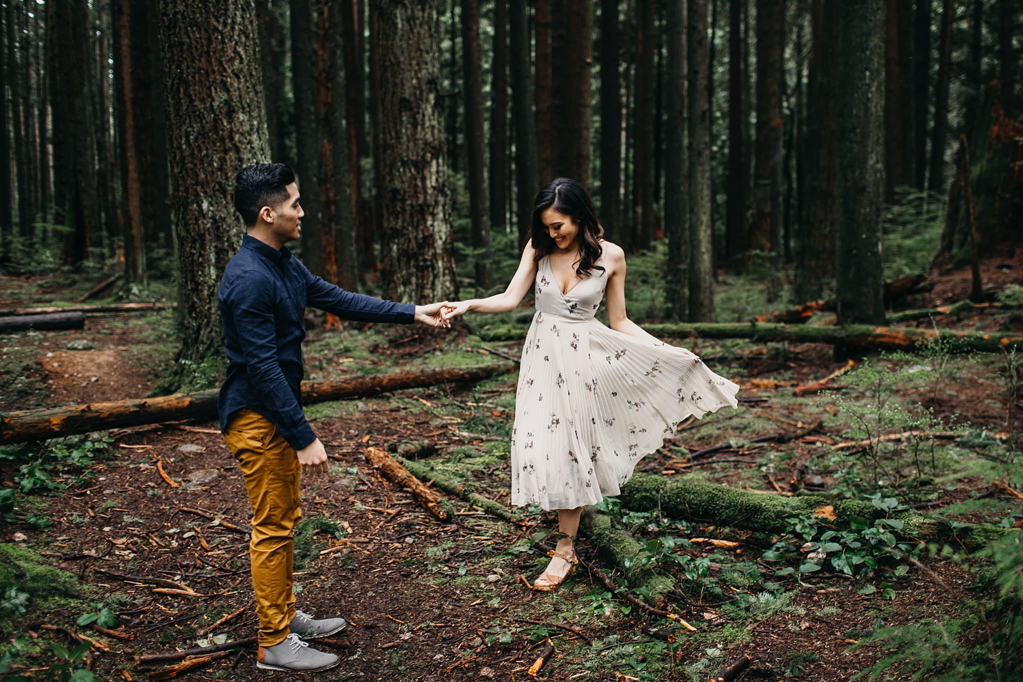 couple dancing in forest flowy boho dress pacific spirit park engagement