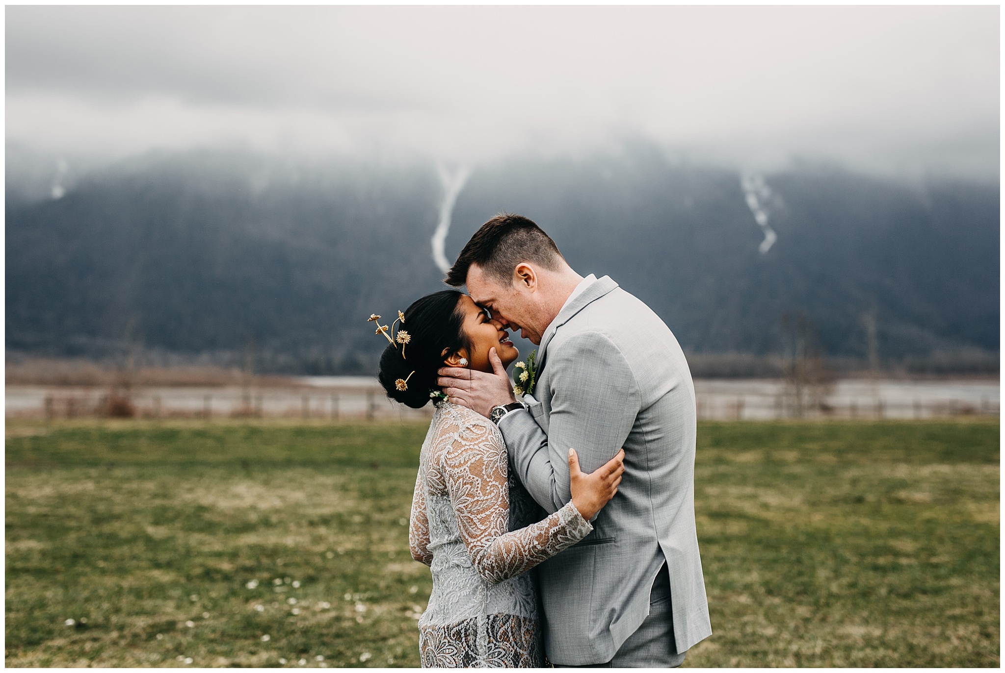 bride and groom first look reaction at fraser river lodge wedding with mountain backdrop