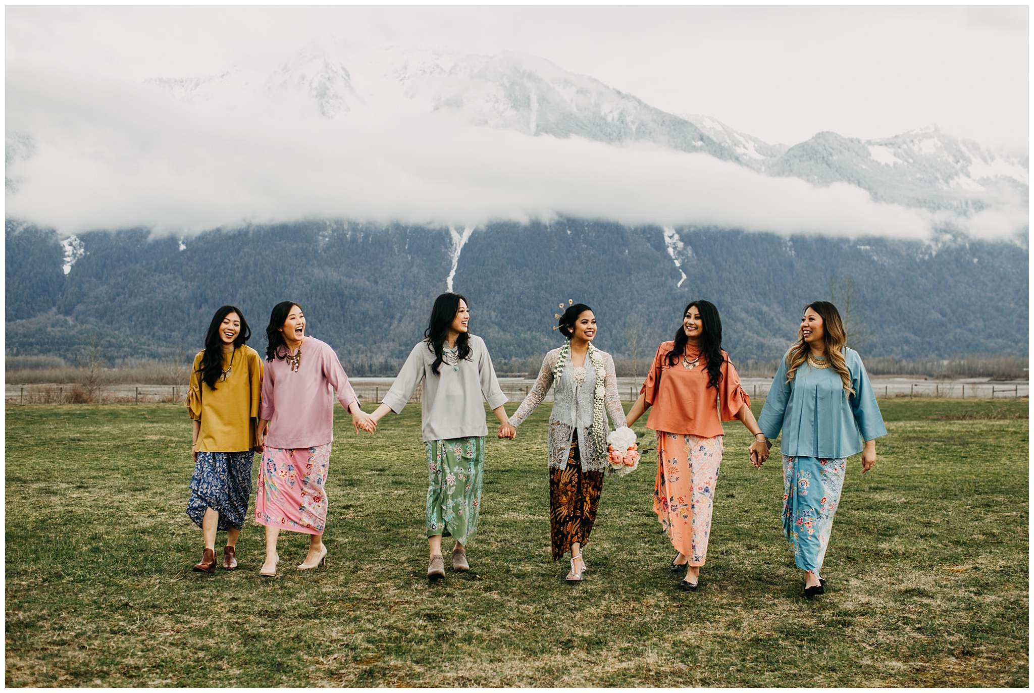 bride and bridesmaids in cultural gowns at fraser river lodge wedding