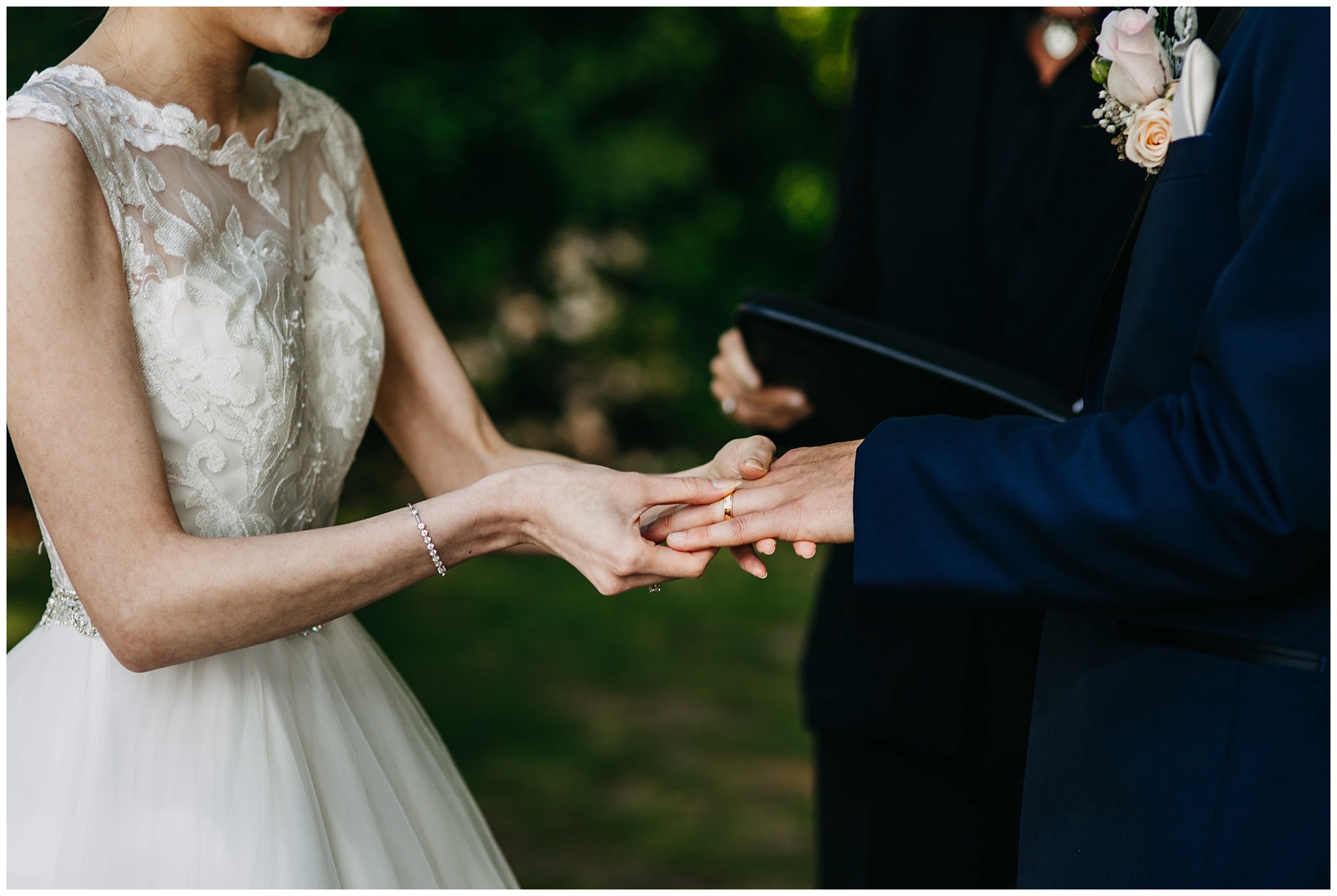 bride and groom exchanging rings at stanley park teahouse wedding