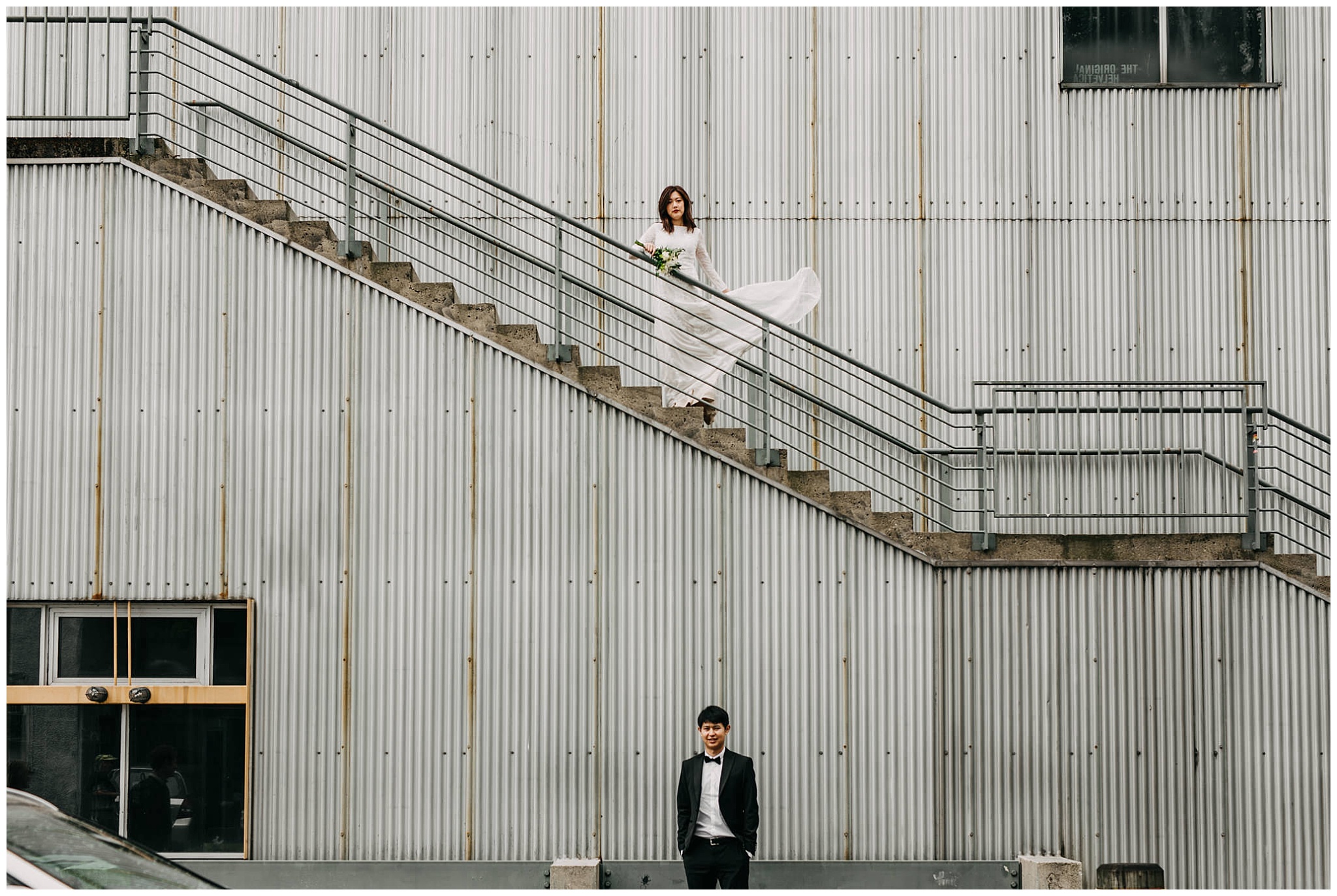 bride and groom portrait on stairs at granville island