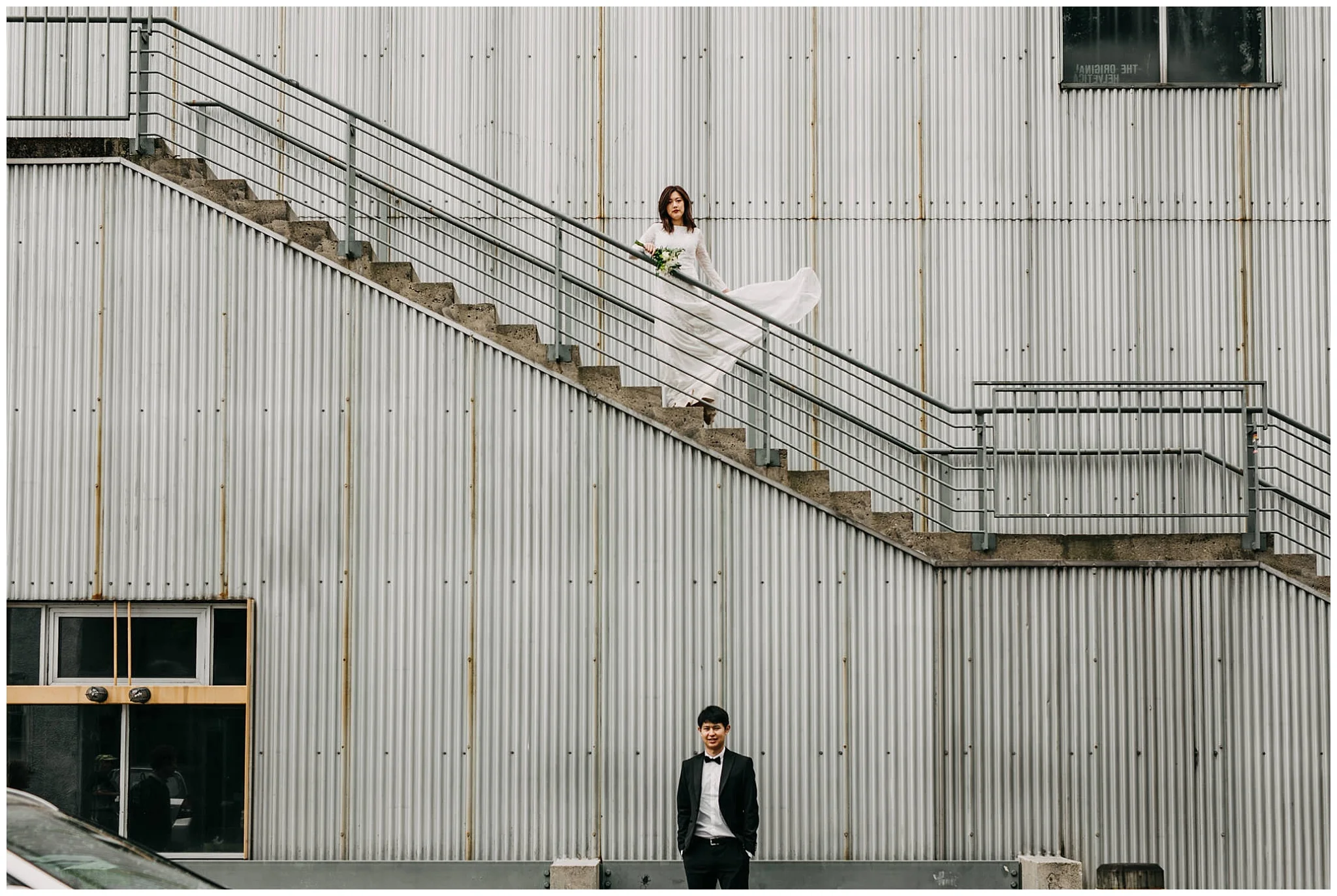 bride and groom portrait on stairs at granville island