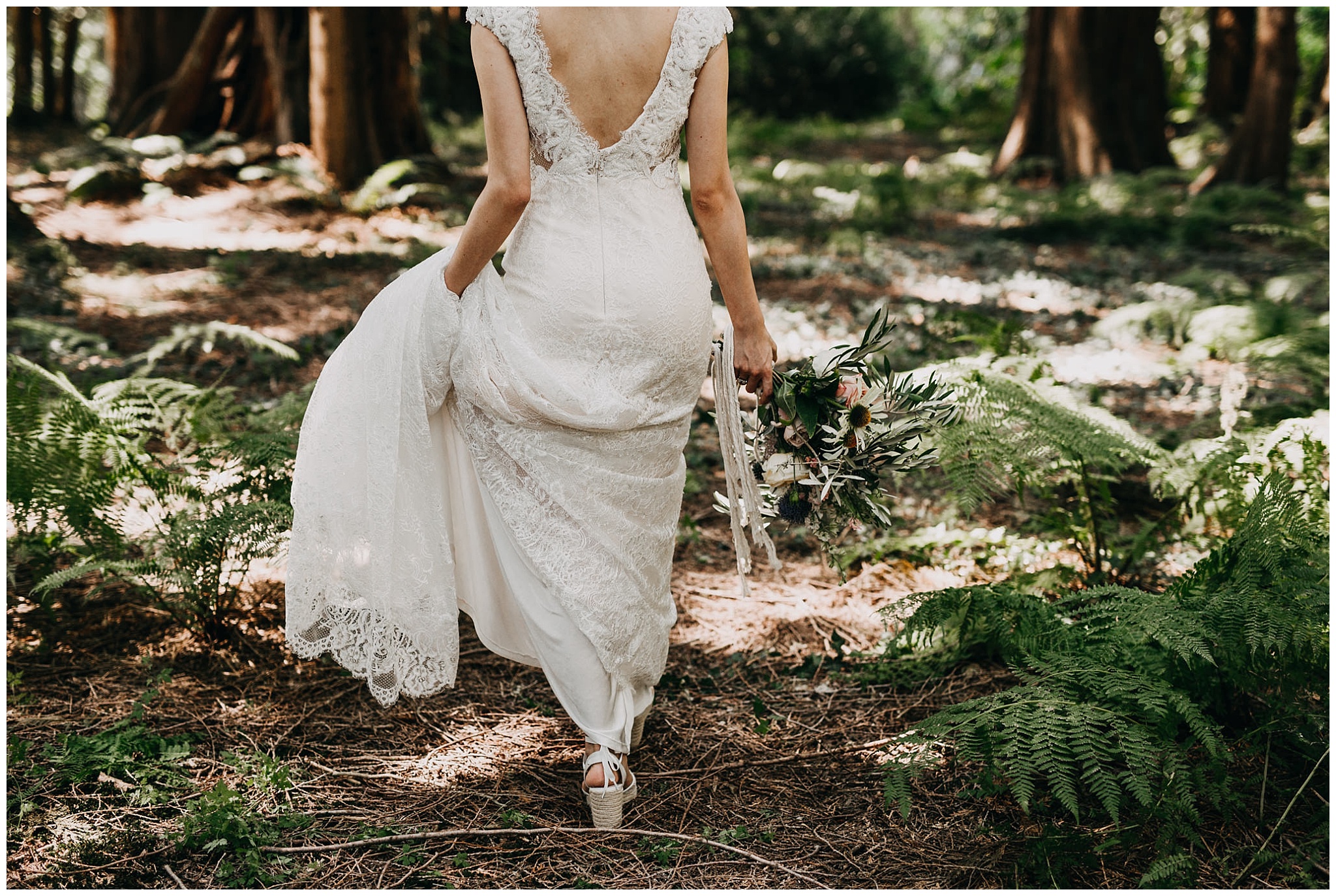 bride walking in forest at krause berry farm wedding
