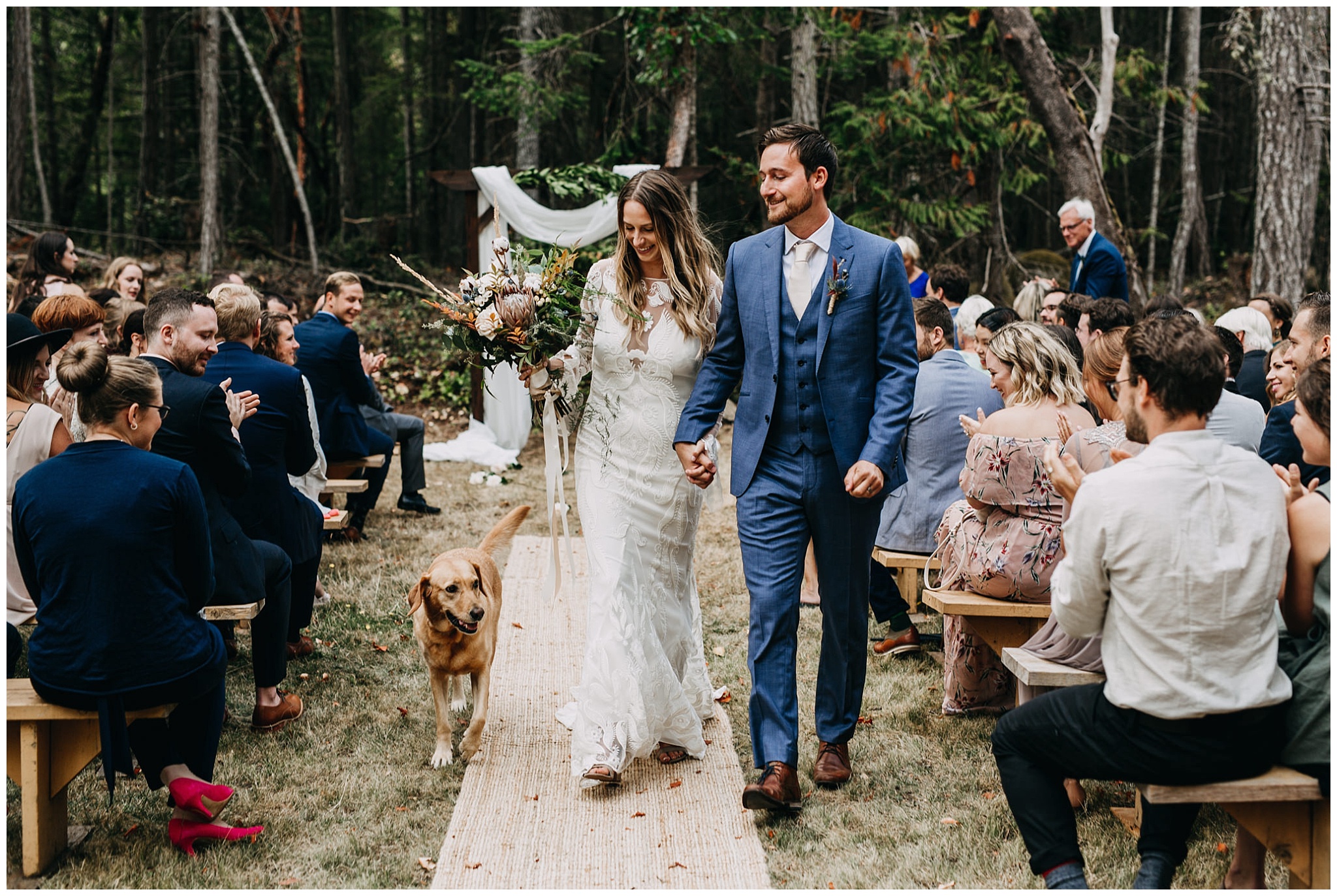 bride and groom ceremony exit with dog at intimate mayne island backyard wedding