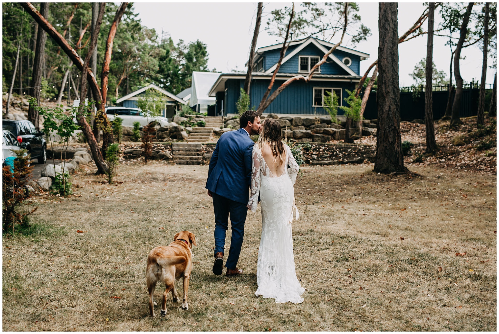 bride and groom exiting ceremony with their dog at intimate mayne island backyard wedding