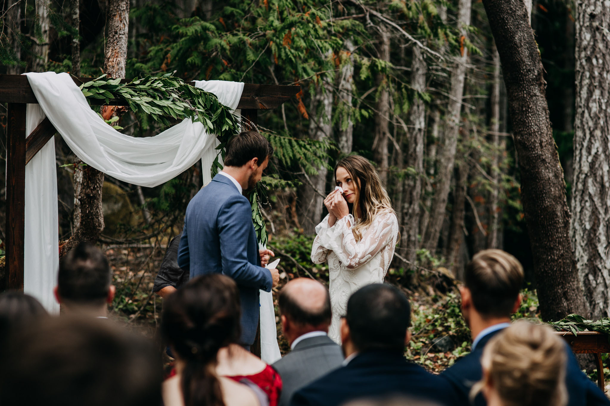bride crying during vows at intimate mayne island backyard wedding