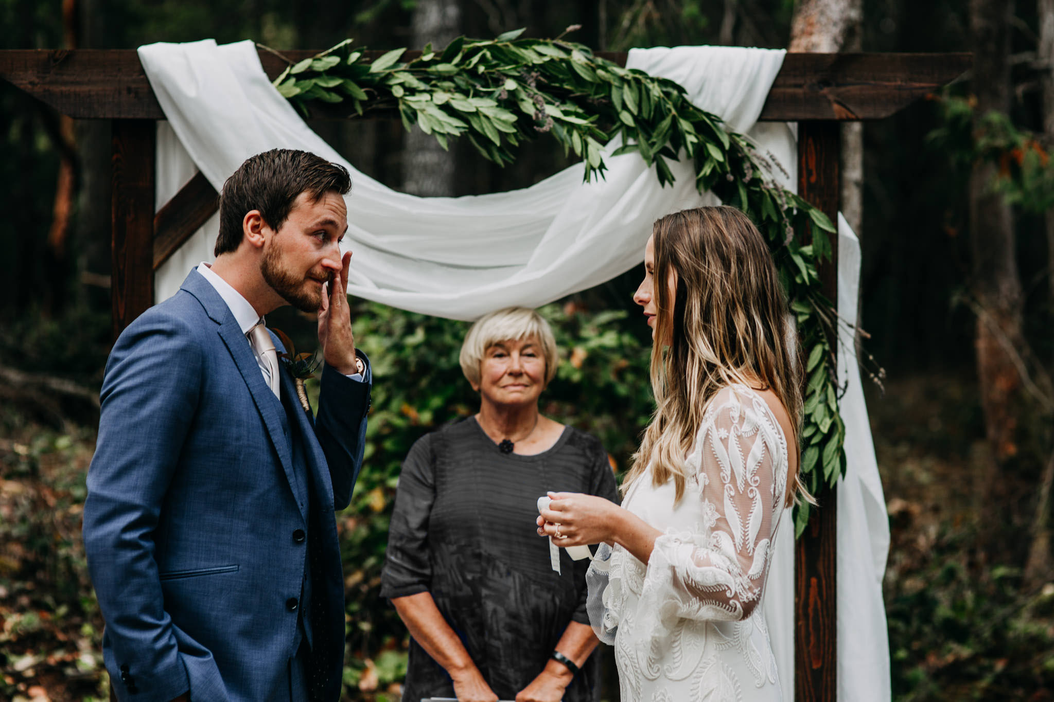 groom crying during vows at intimate mayne island backyard wedding