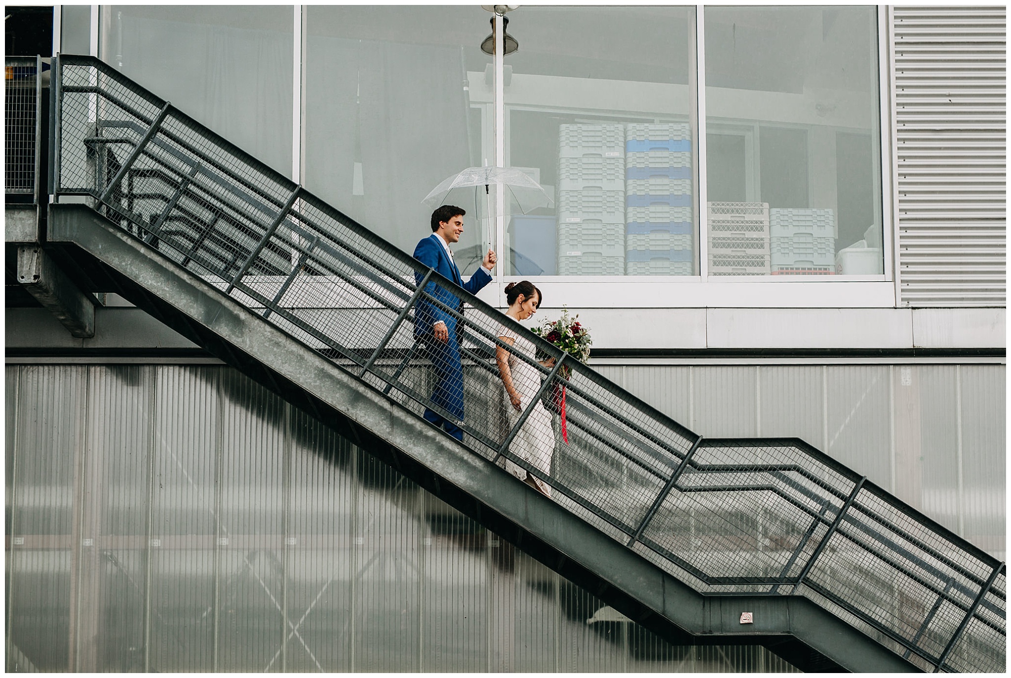 bride and groom walking down stairs at ubc boathouse wedding