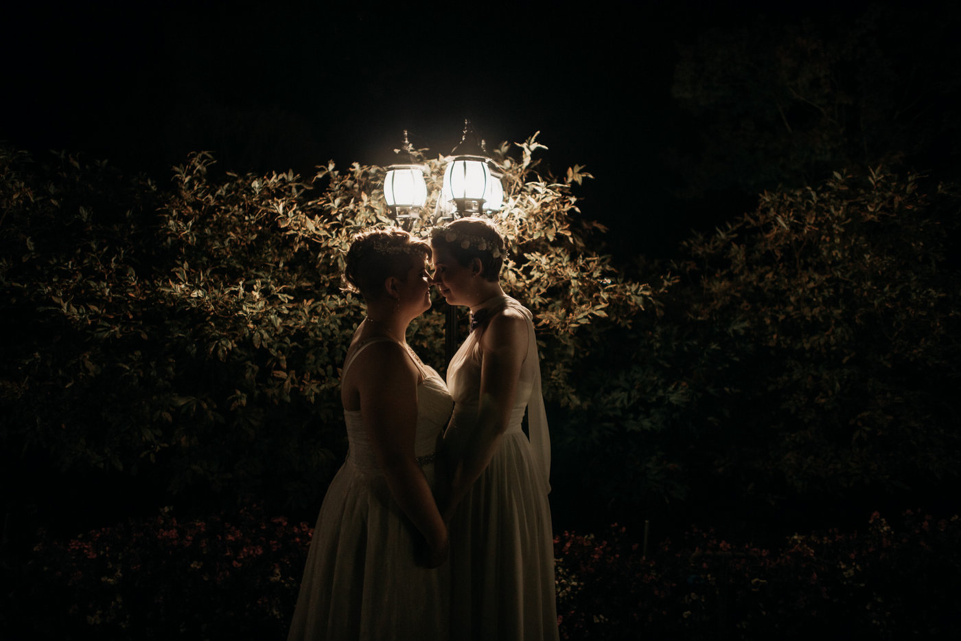 same sex couple night time portrait at vancouver wedding