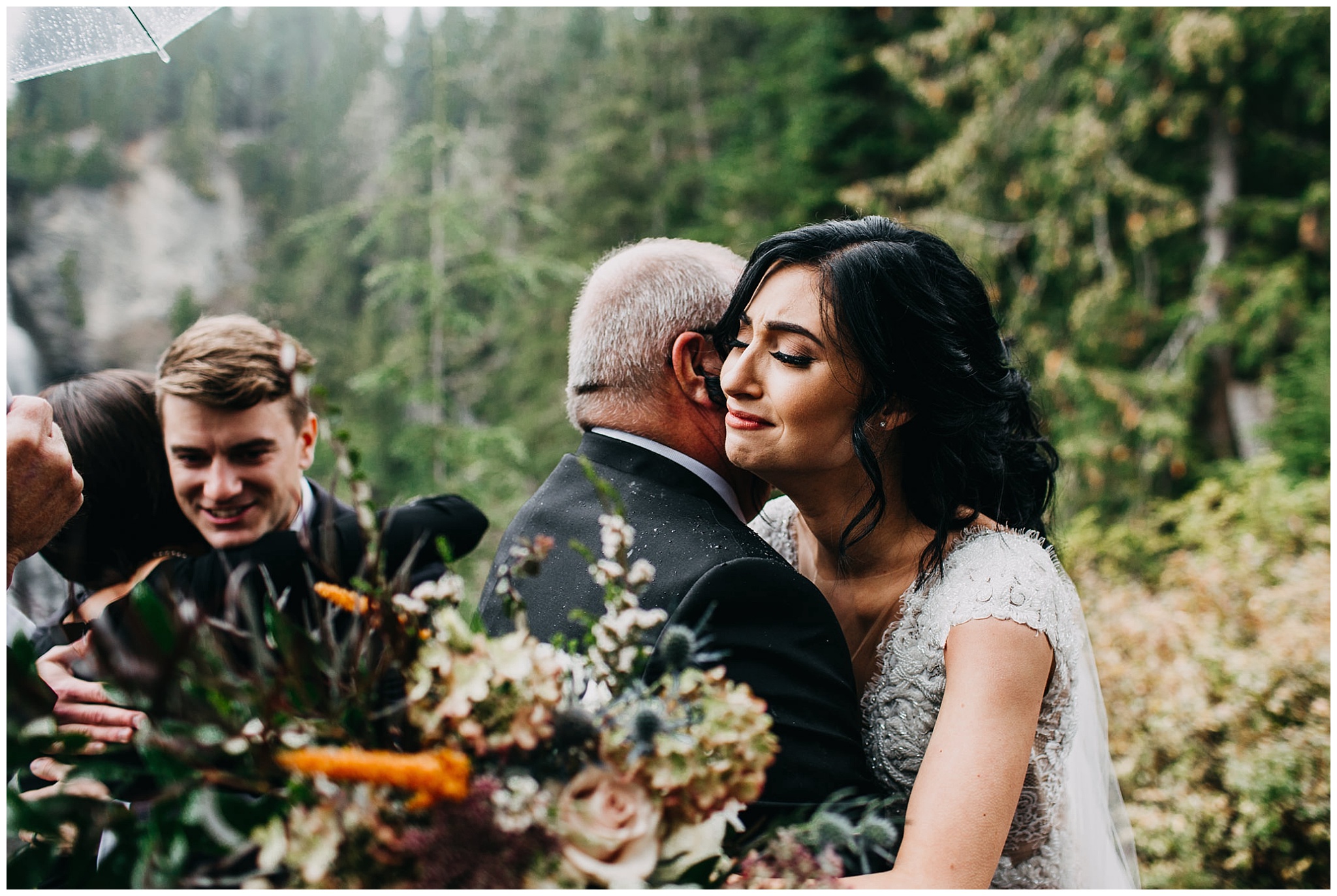 emotional moment of bride hugging father 