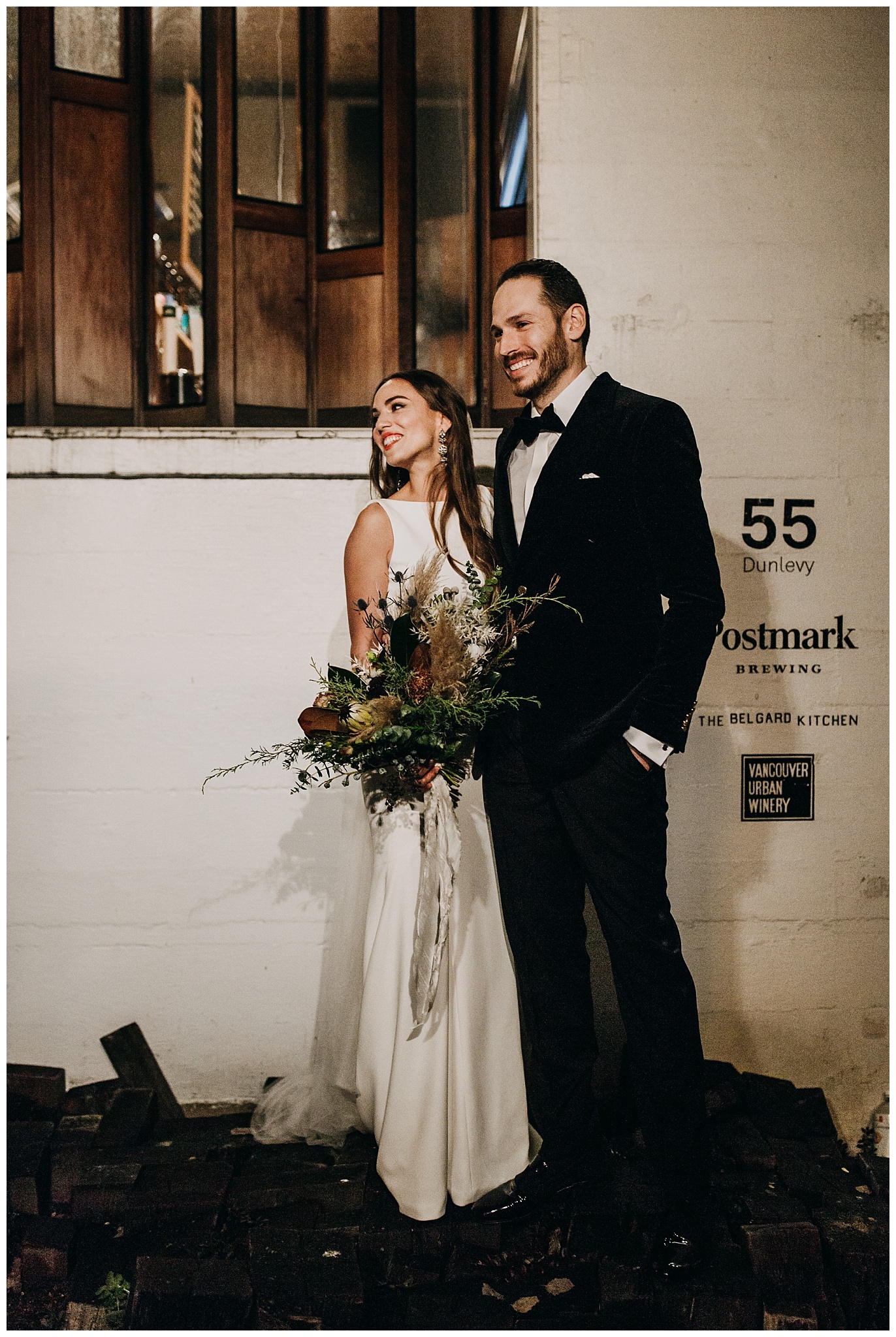 bride and groom wedding portrait outside Postmark Brewing