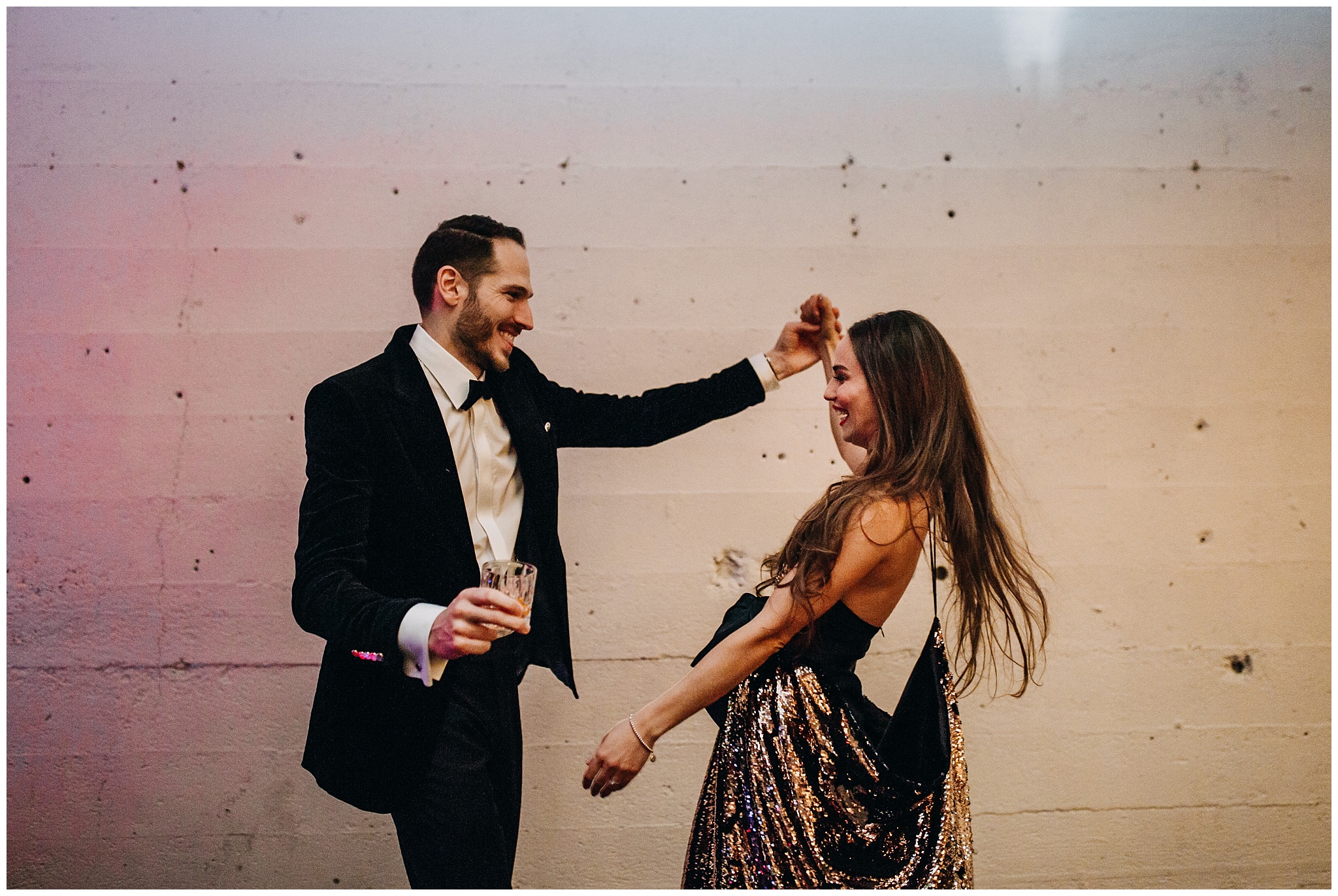 bride and groom dancing at settlement building wedding