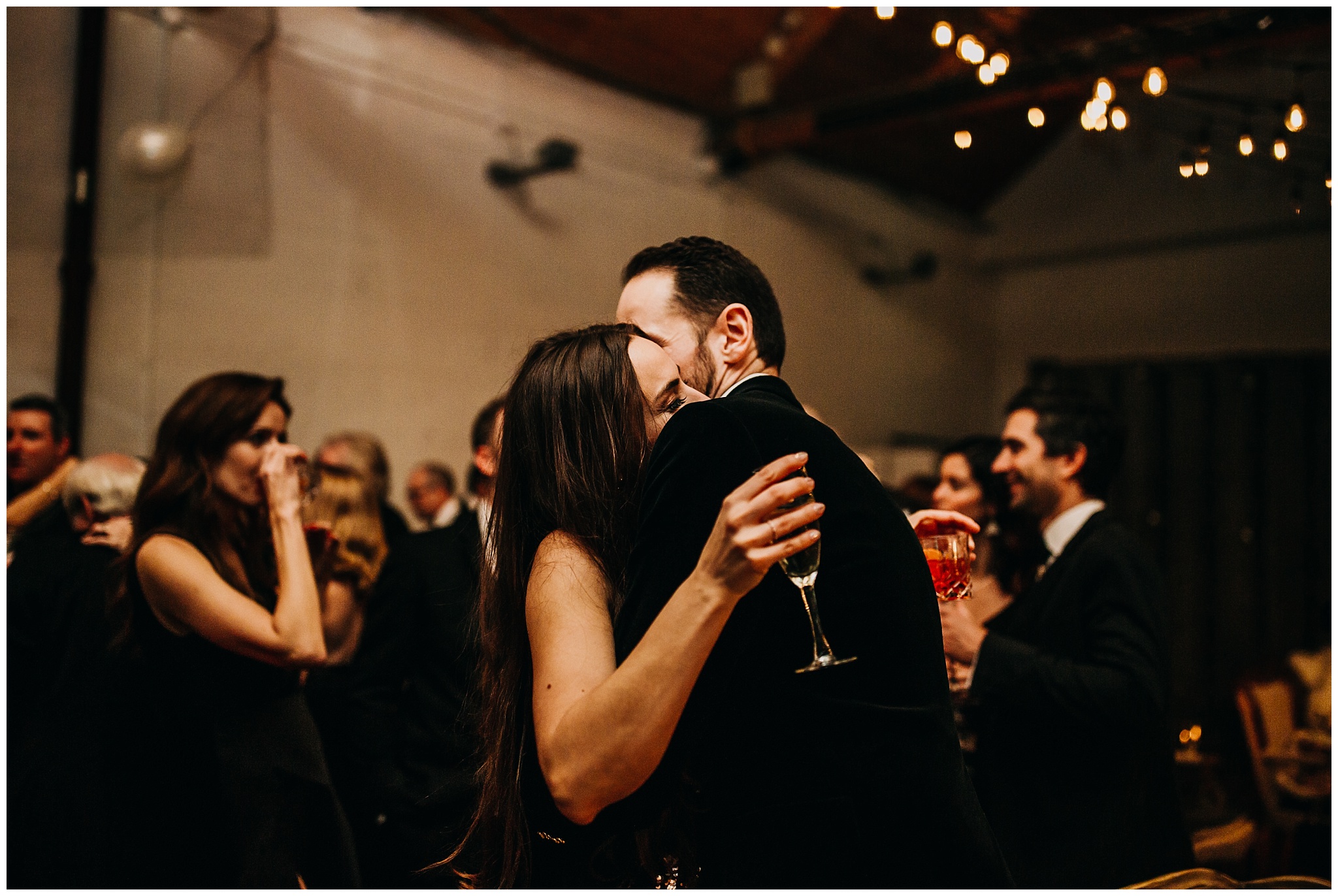 bride and groom candid moment after new years countdown at settlement building wedding