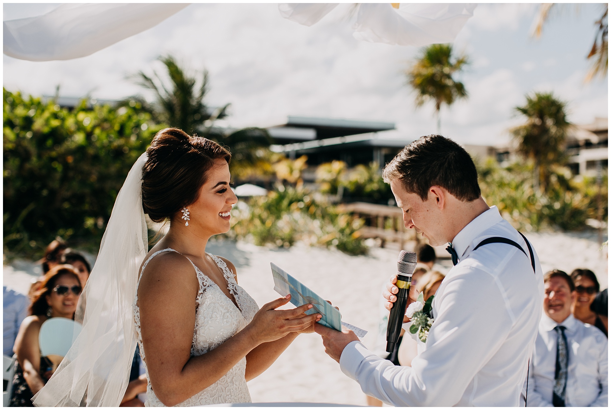 bride and groom exchange vows on beach at cancun mexico wedding