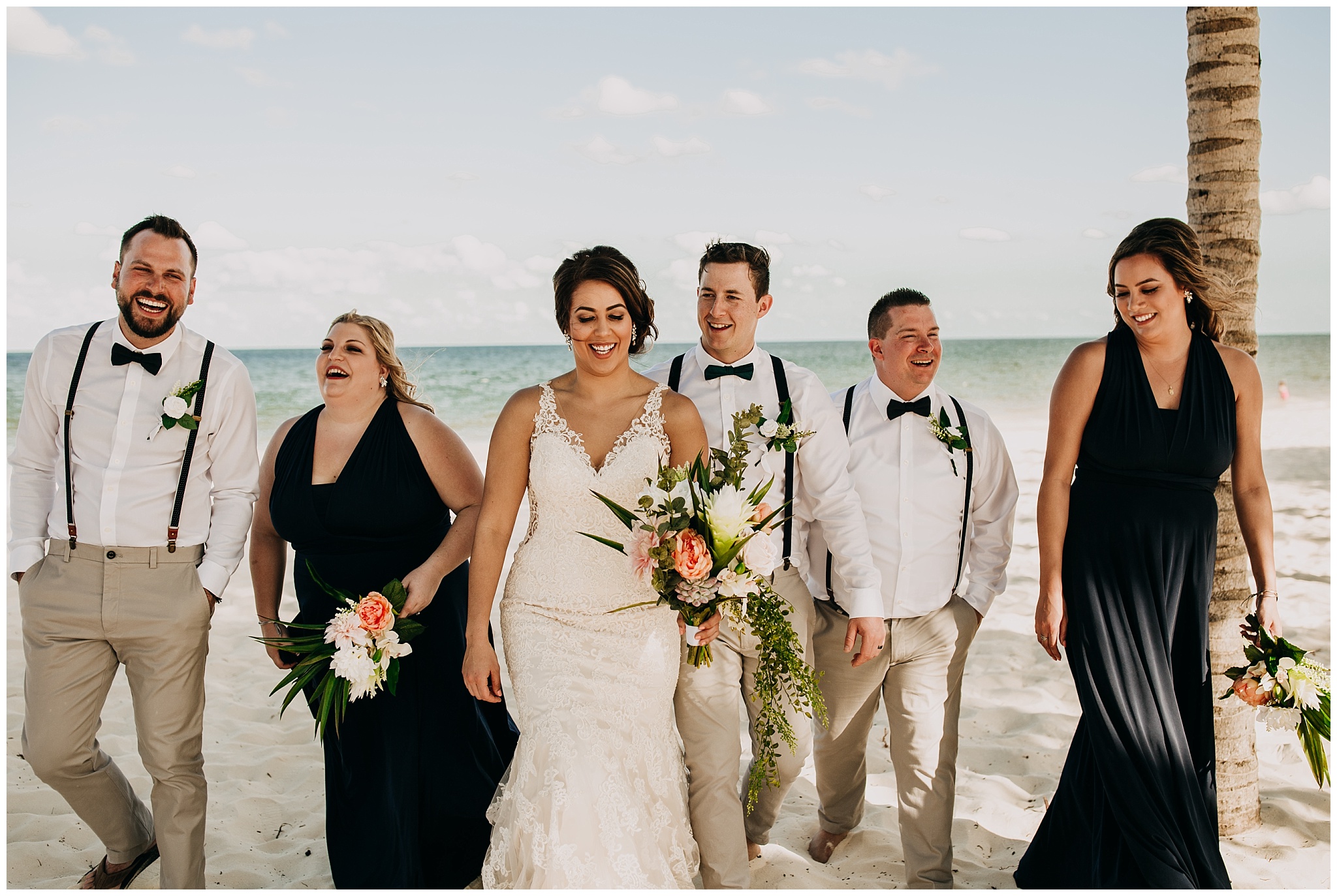 wedding party portrait on the beach at cancun mexico wedding