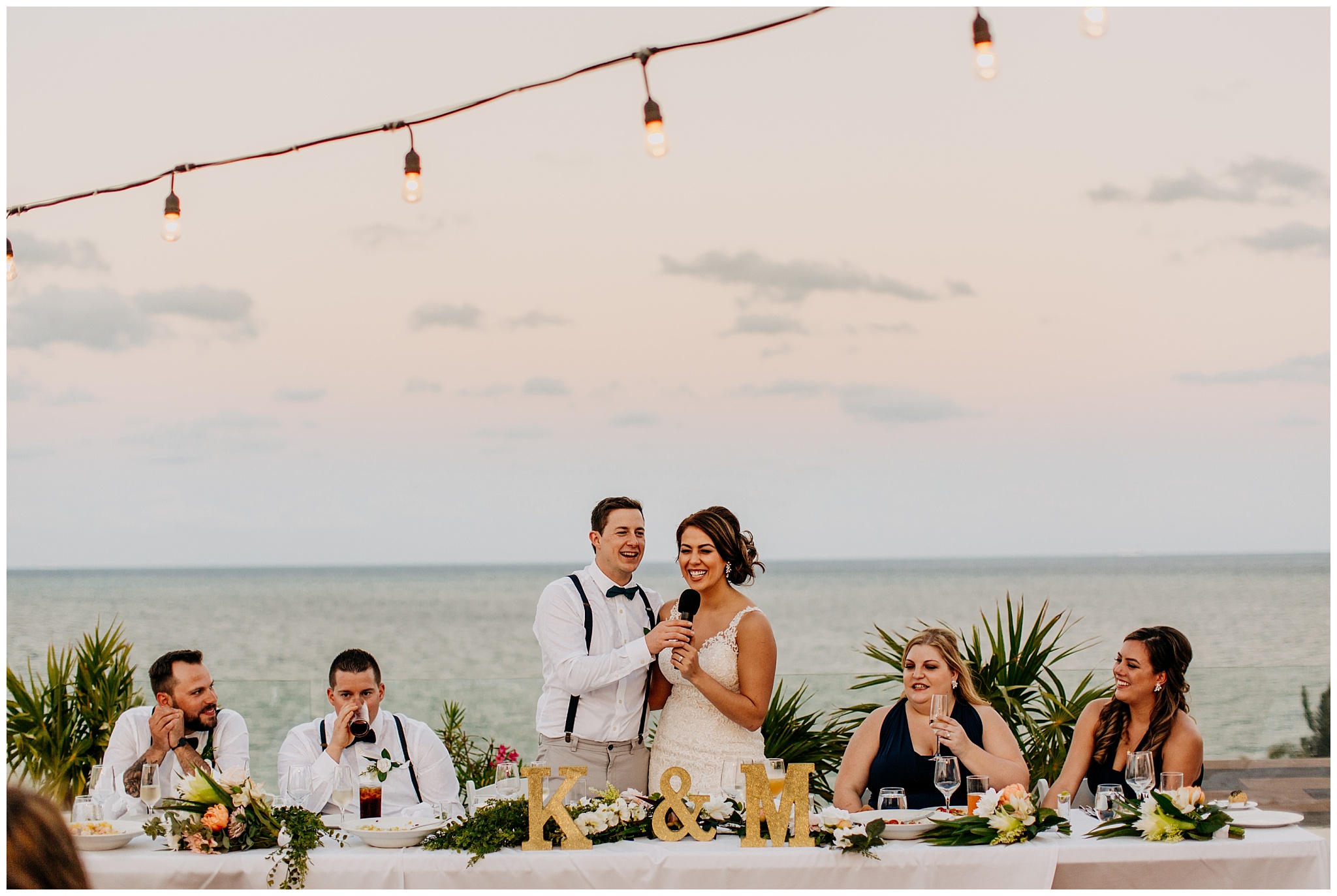 bride and groom toast at cancun mexico wedding reception