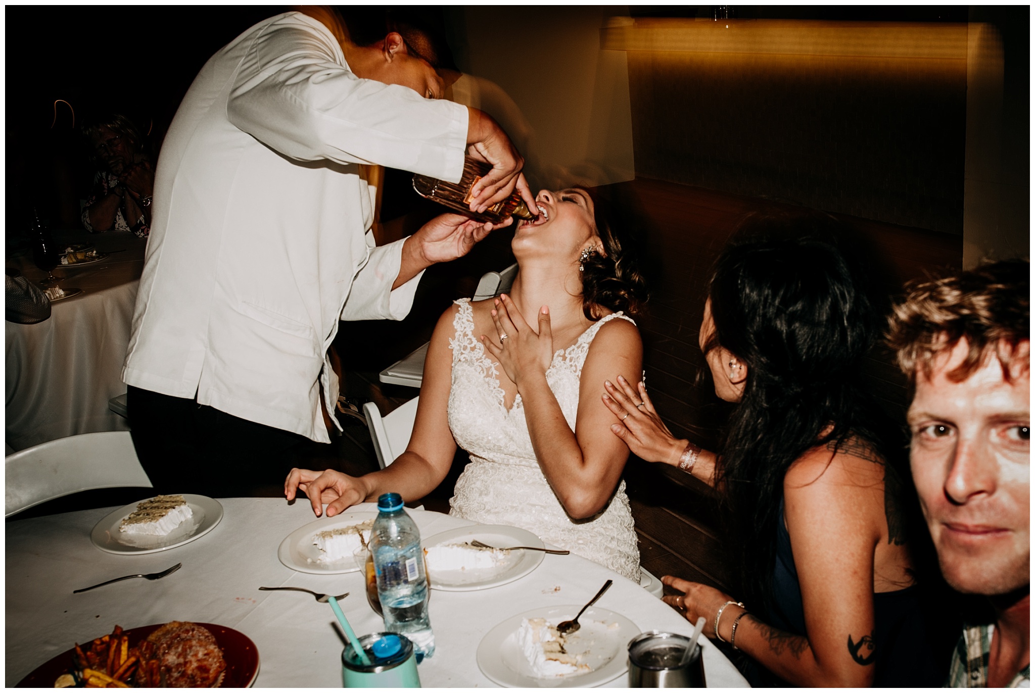 tequila poured down bride's mouth at cancun mexico wedding