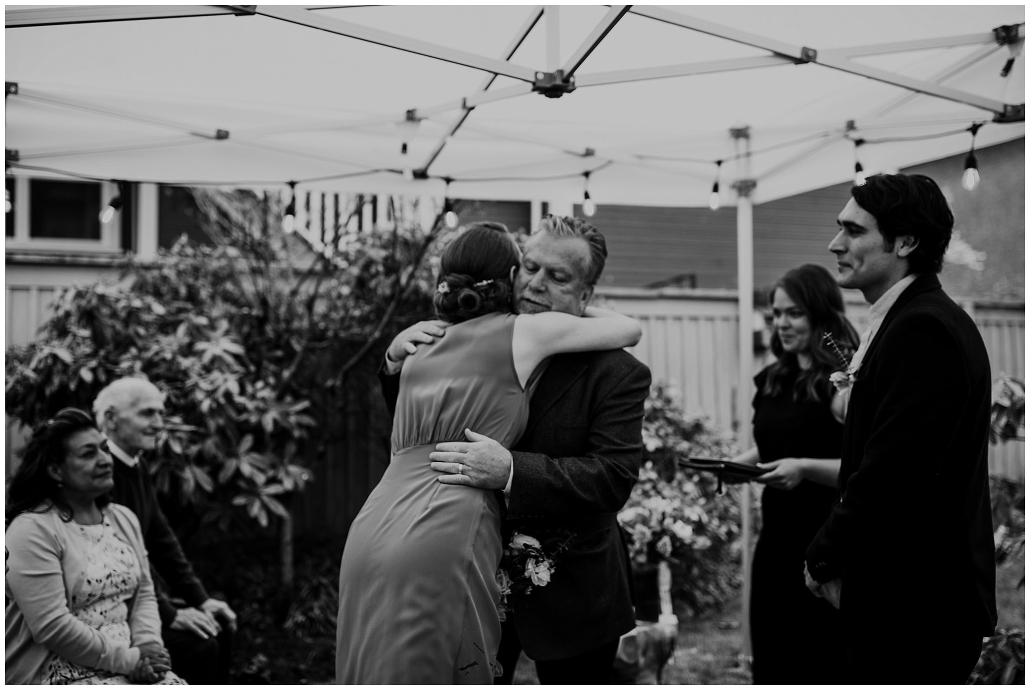 bride and father hug during ceremony at vancouver backyard elopement