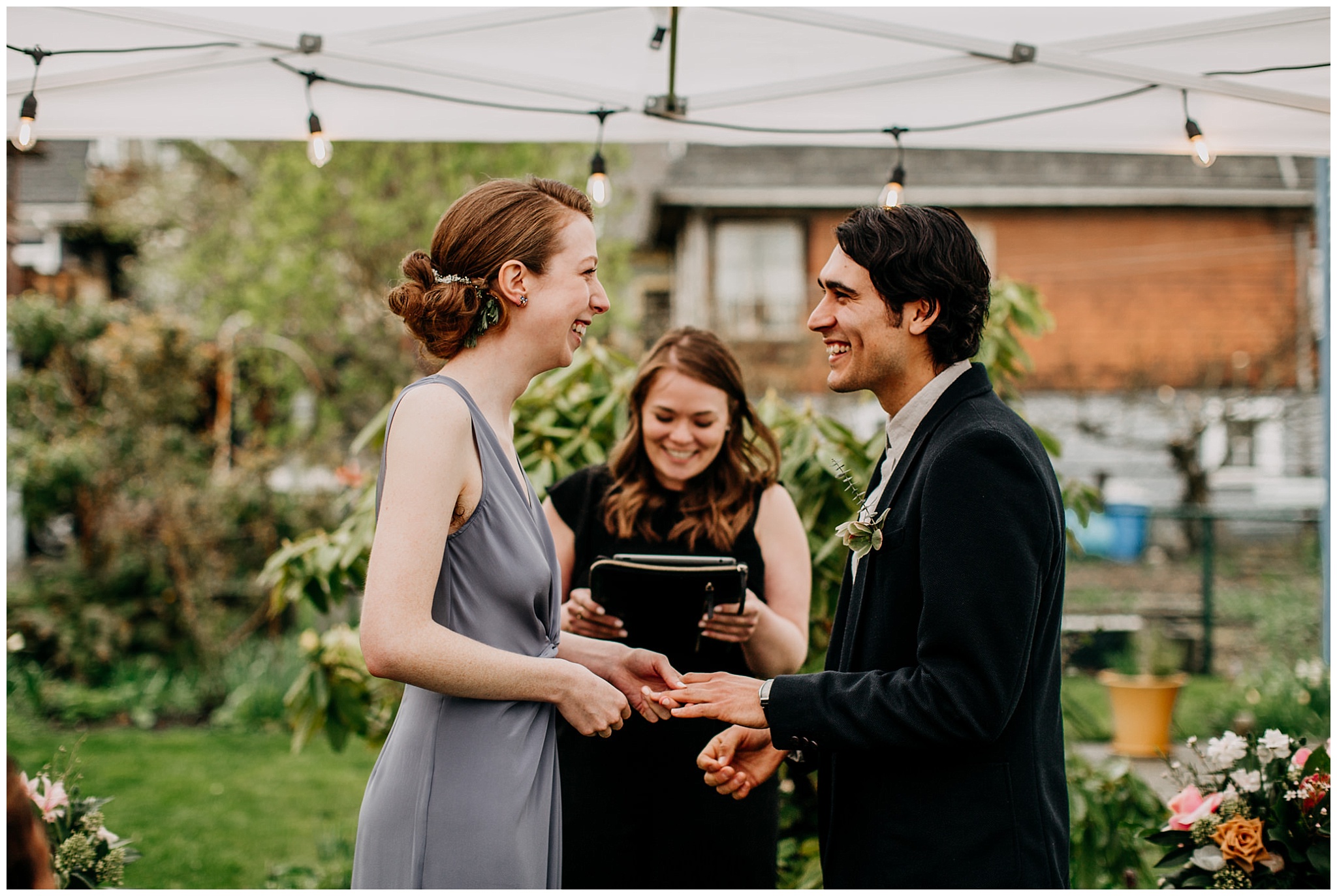 bride and groom exchanging rings during vancouver backyard elopement