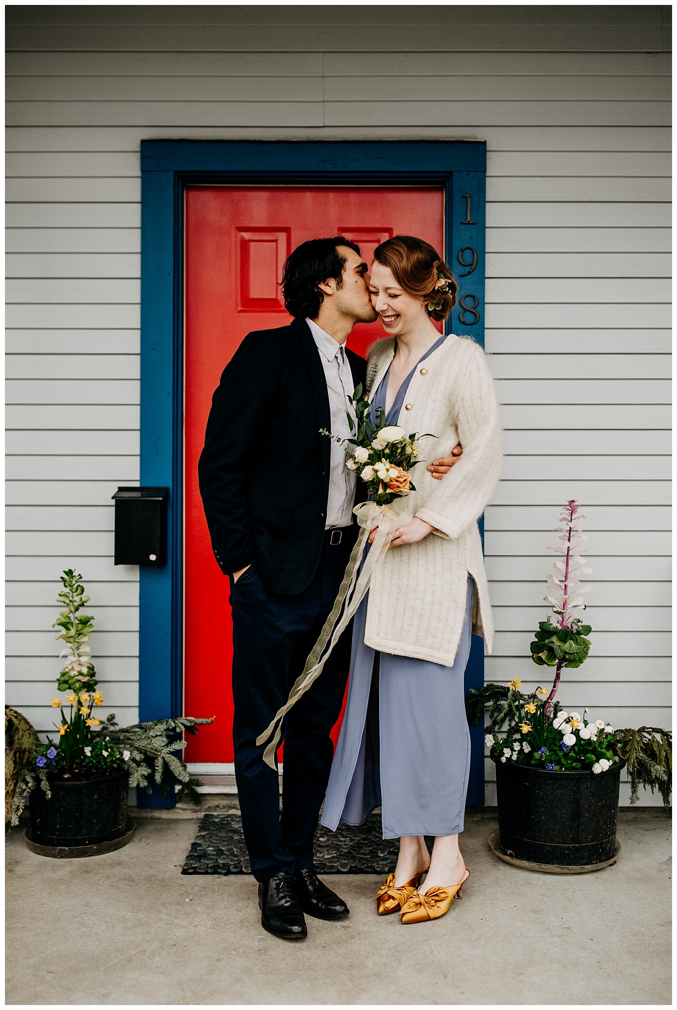 bride and groom portrait in front of vancouver home