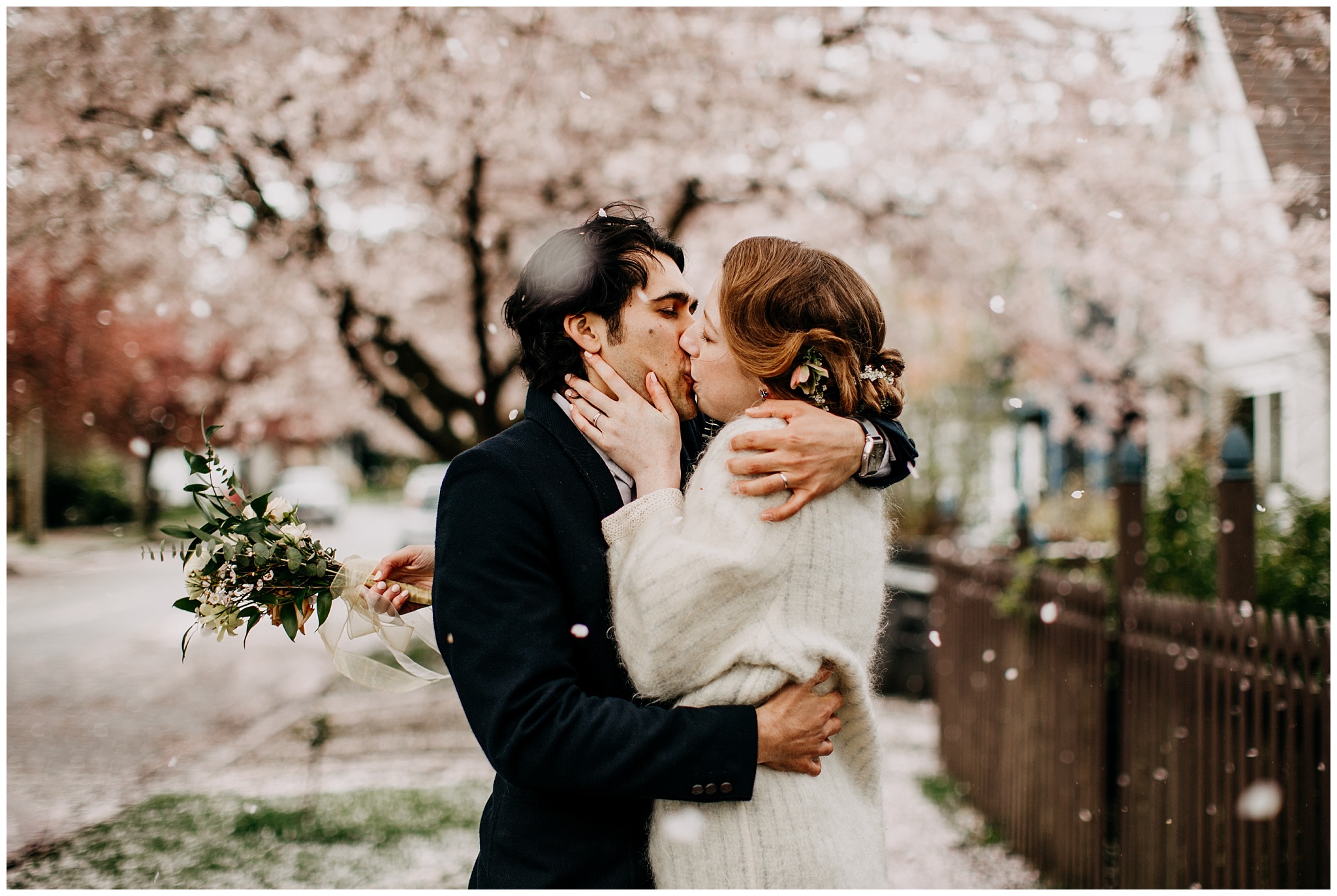 bride and groom portrait under cherry blossom tree in vancouver