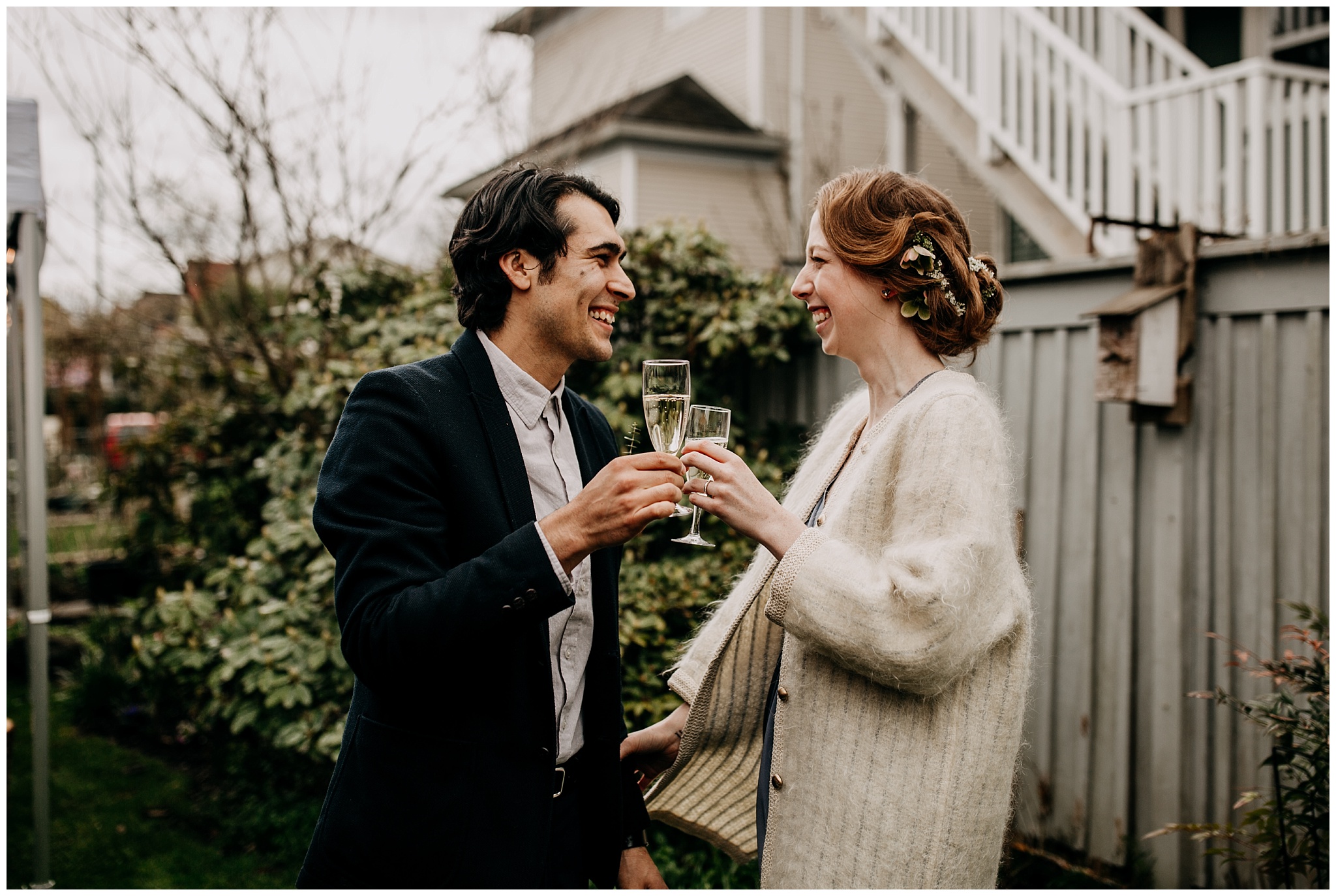 bride and groom champagne toast during vancouver backyard elopement
