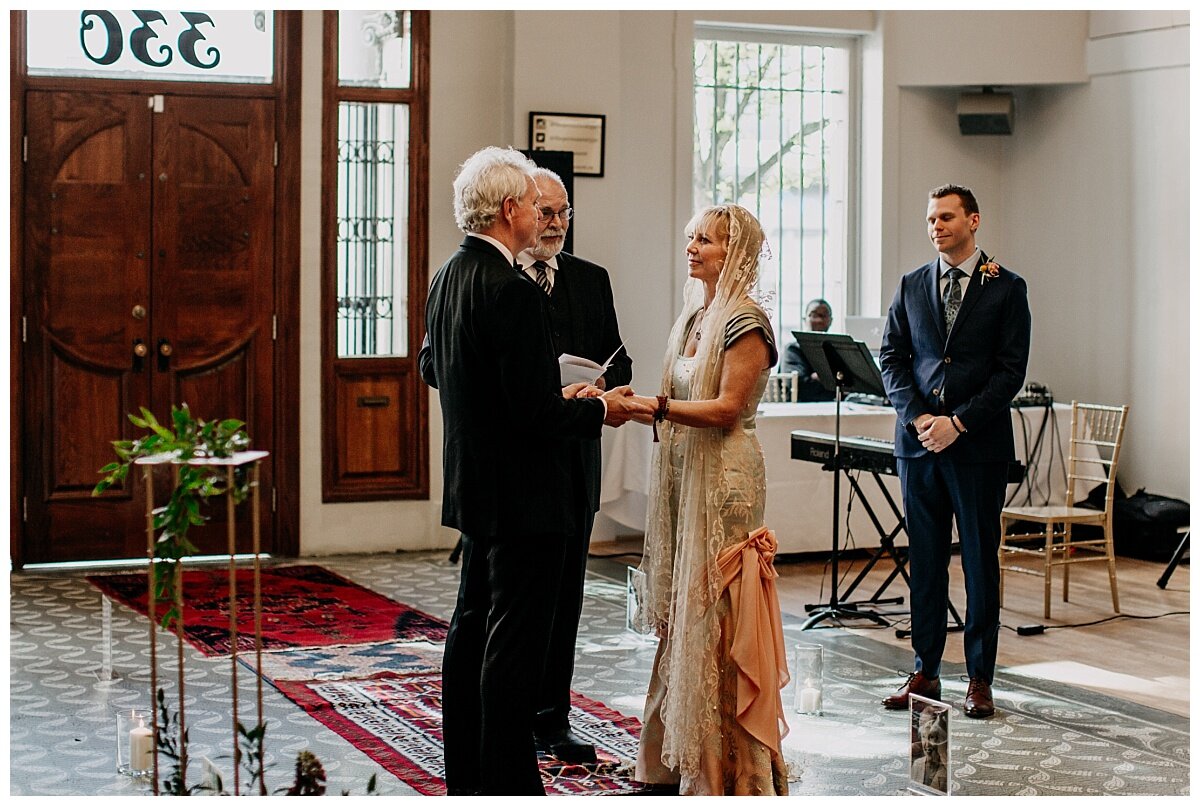 bride and groom during ceremony at the permanent wedding