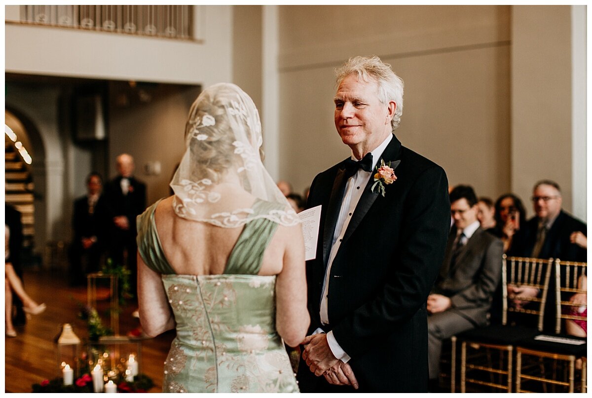 groom's reaction to bride's vows during ceremony at the permanent