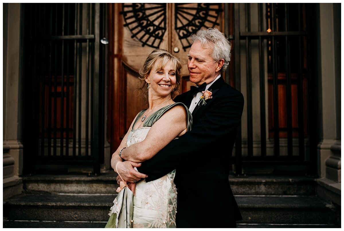 bride and groom portrait in front of doors at the permanent