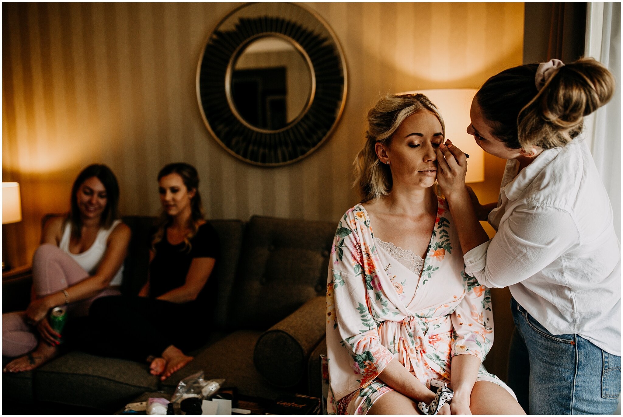 bride getting her makeup done on wedding day in vancouver