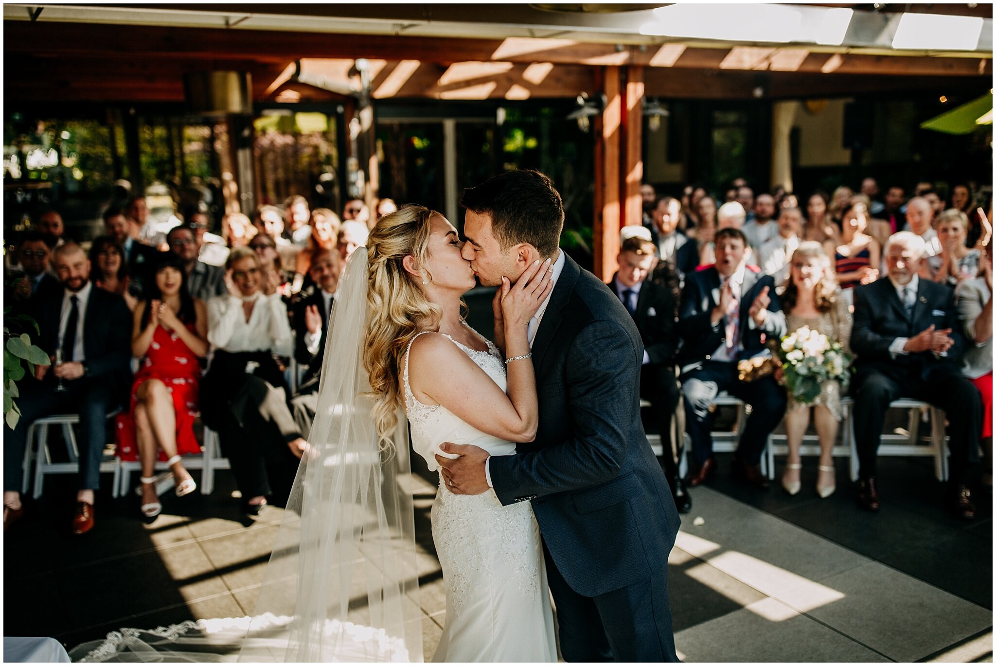 bride and groom first kiss at shaughnessy restaurant wedding ceremony