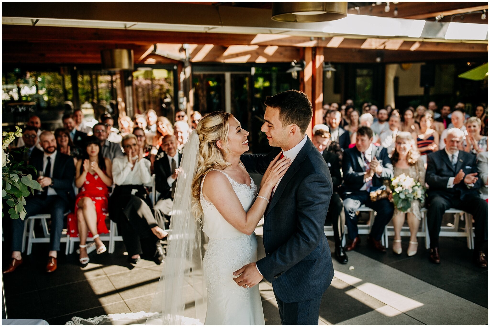 bride and groom first kiss at shaughnessy restaurant wedding