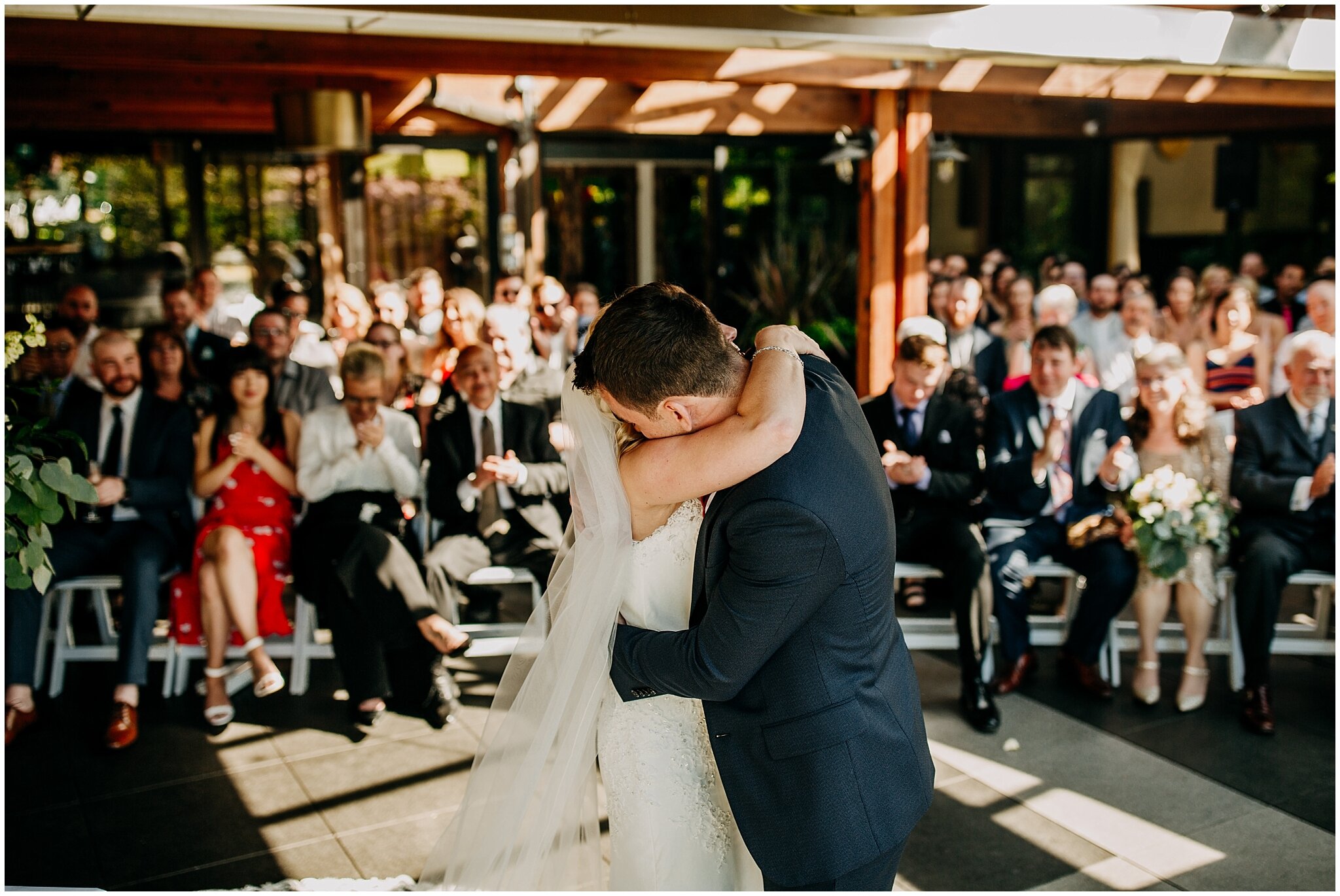 bride and groom hugging at shaughnessy restaurant wedding