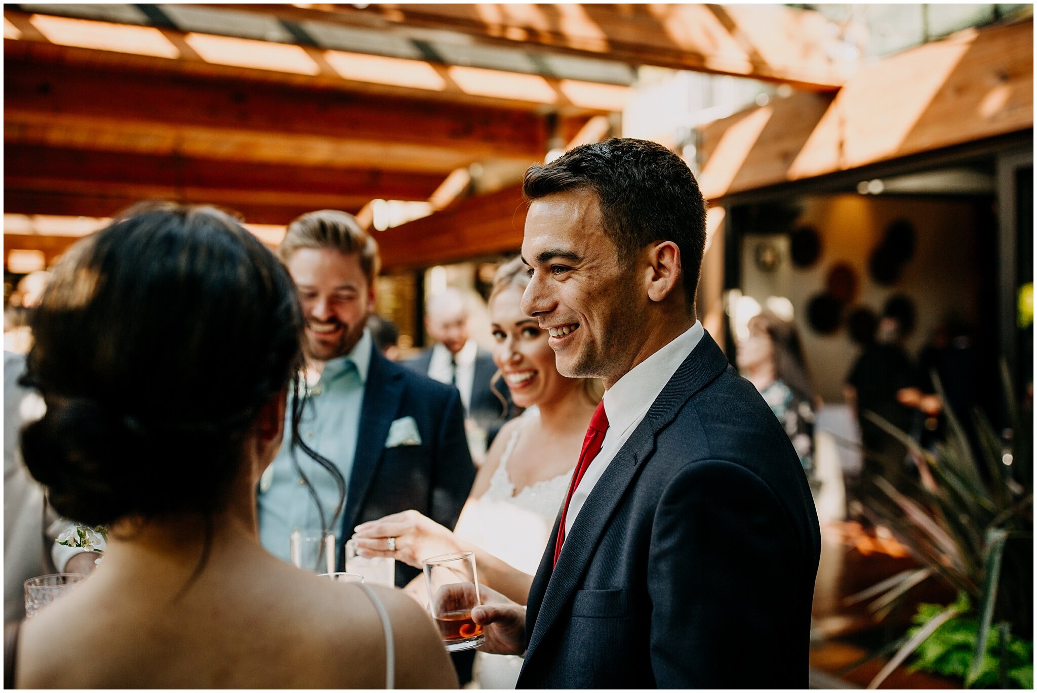groom mingling with guests during cocktail hour at shaughnessy restaurant wedding