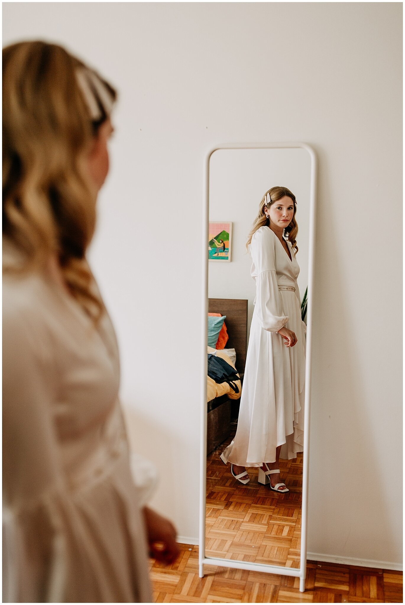 bride's reflection in mirror at ellis building wedding