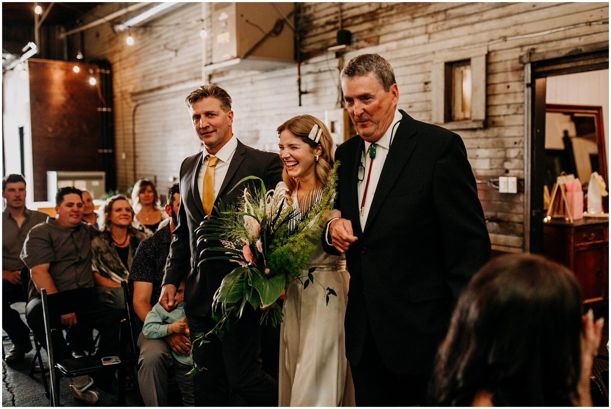 bride walking down aisle at ellis building wedding