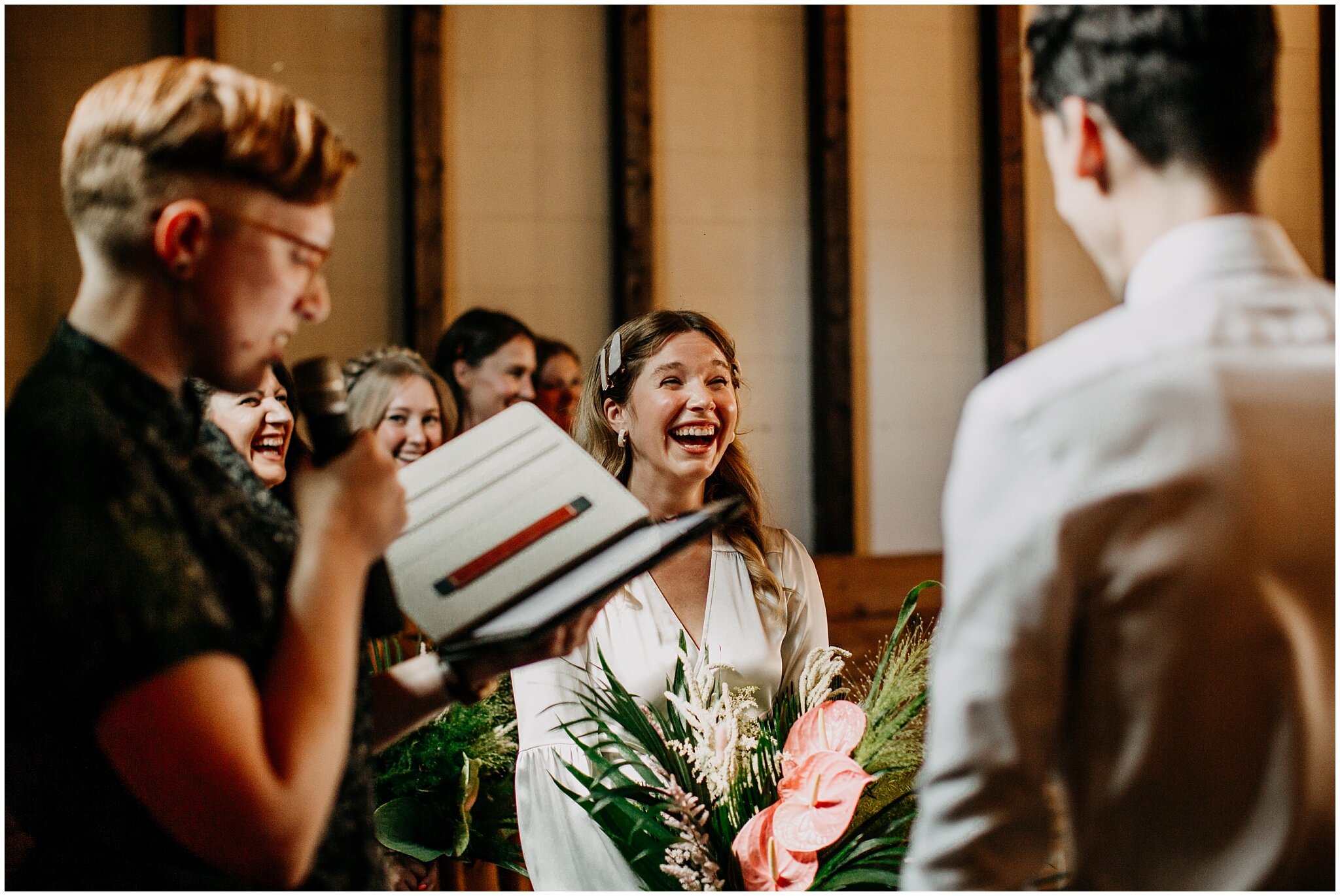bride laughing candid at ceremony at ellis building wedding