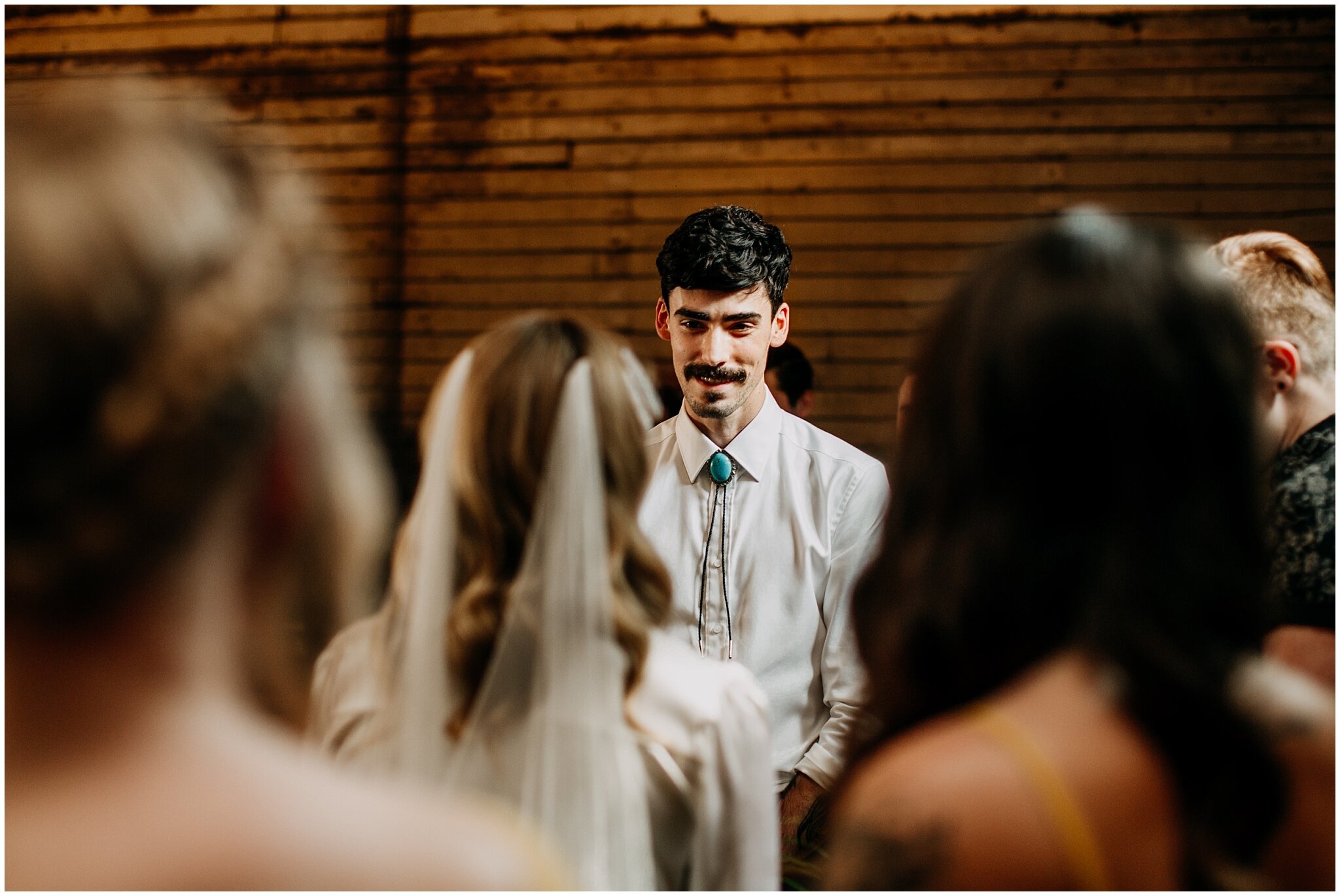 groom's reaction to bride at ellis building ceremony