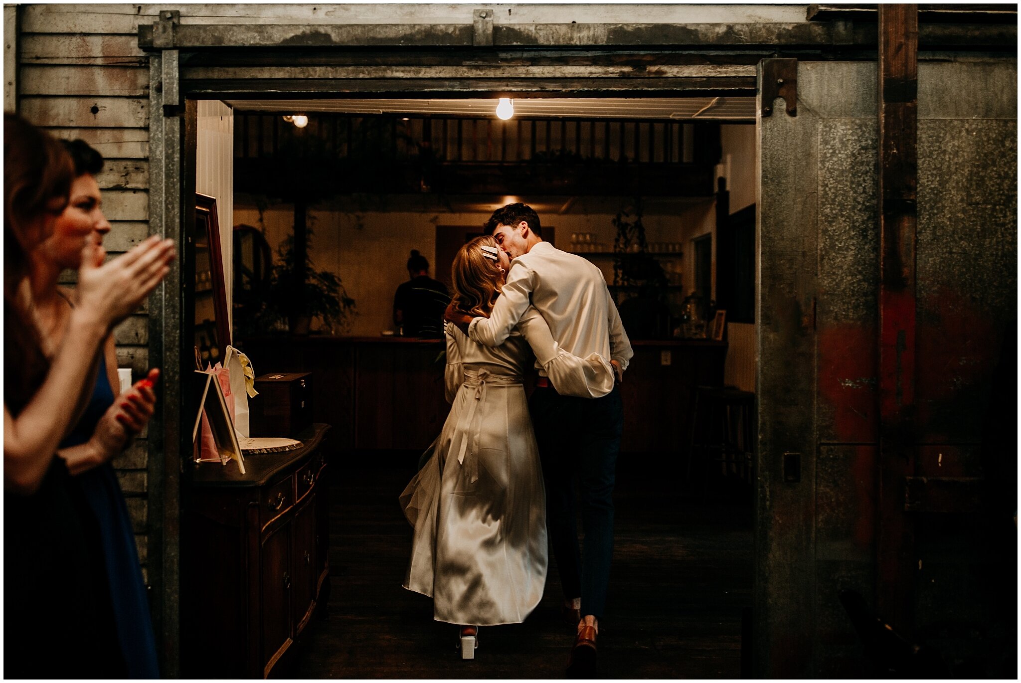 bride and groom candid moment at ceremony exit at ellis building