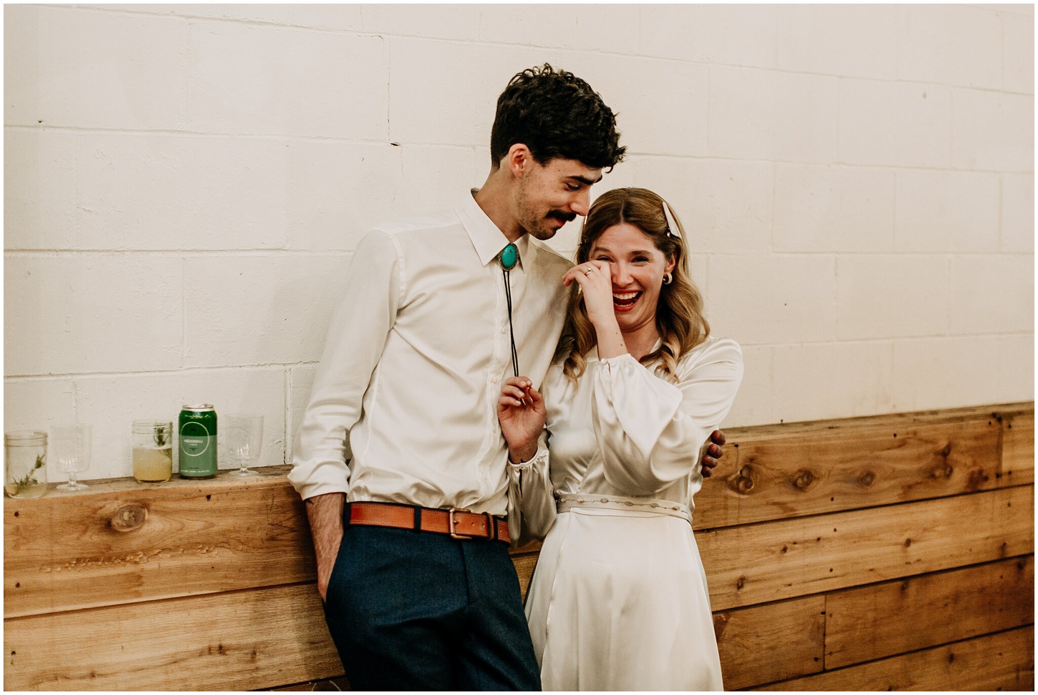 bride and groom emotional reaction during ellis building wedding reception