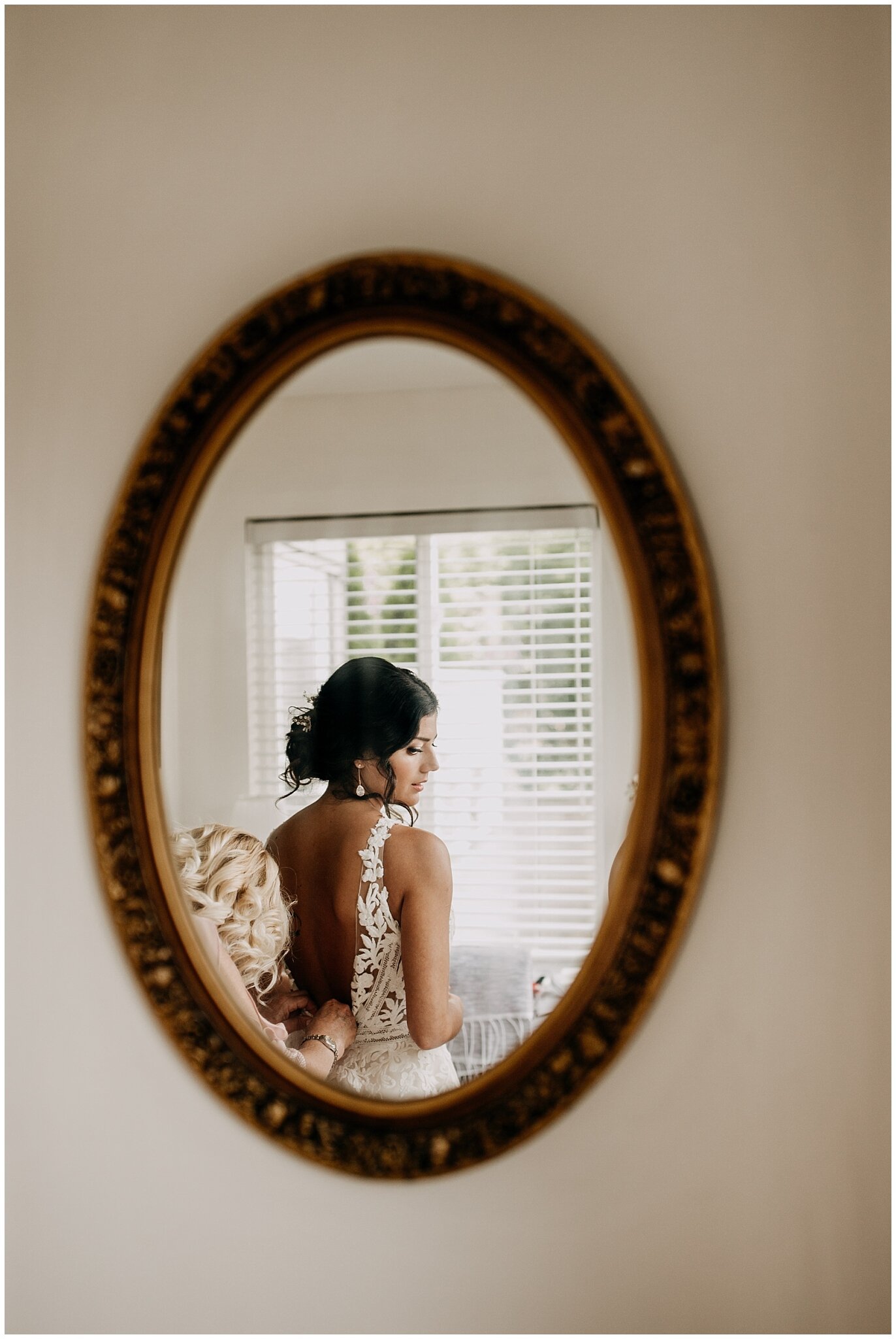 bride mirror portrait at bridges restaurant wedding