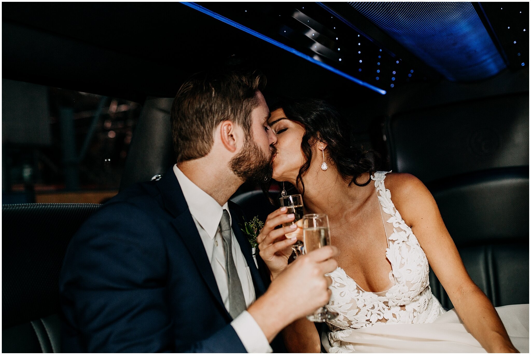 bride and groom kissing in limo at granville island wedding