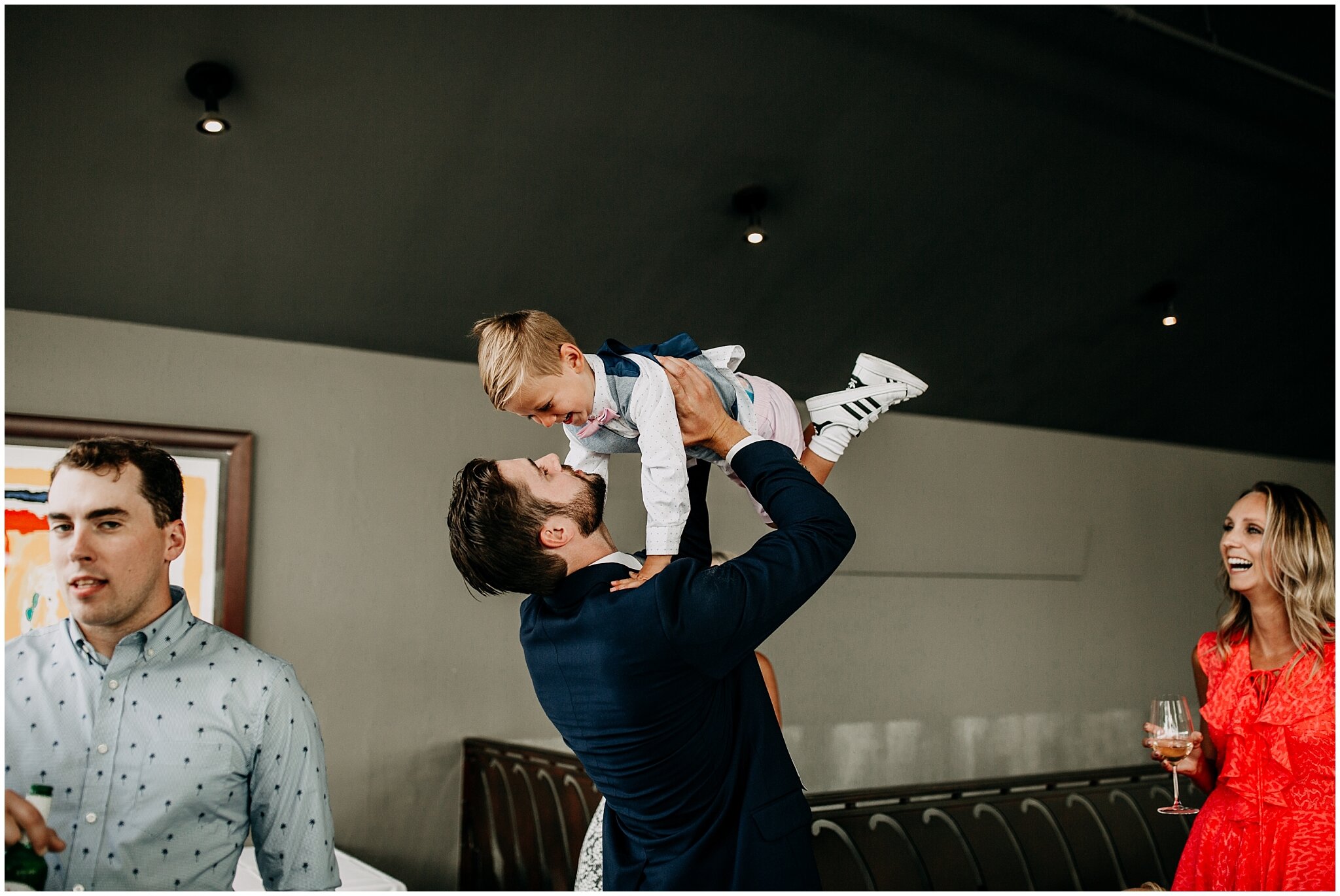 cute moment with groom and nephew at bridges restaurant wedding