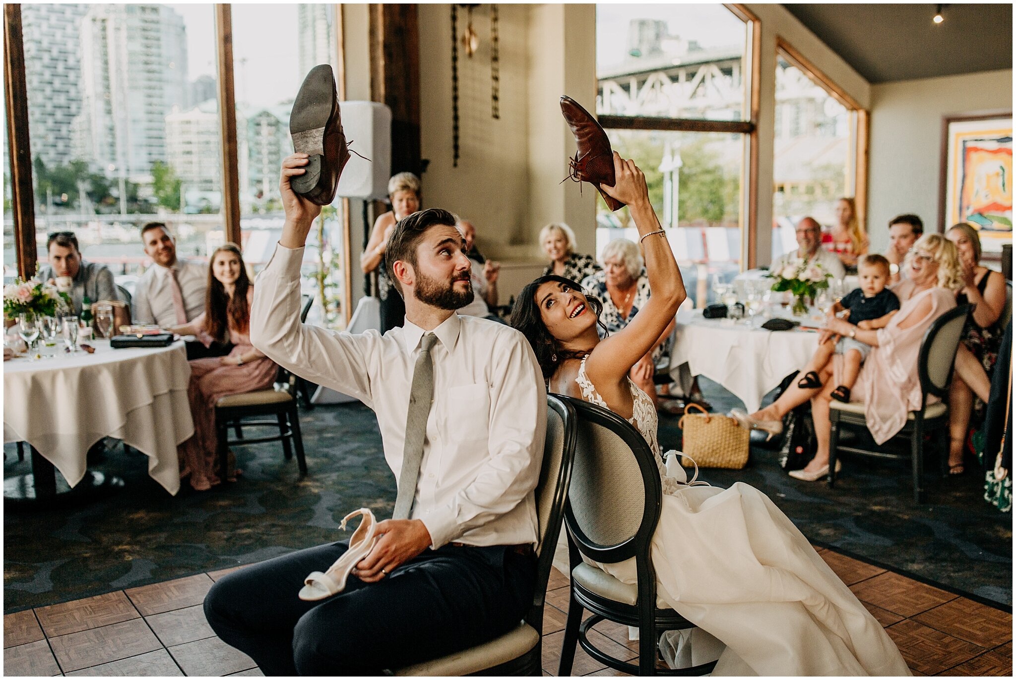 bride and groom playing shoe game at bridges restaurant wedding