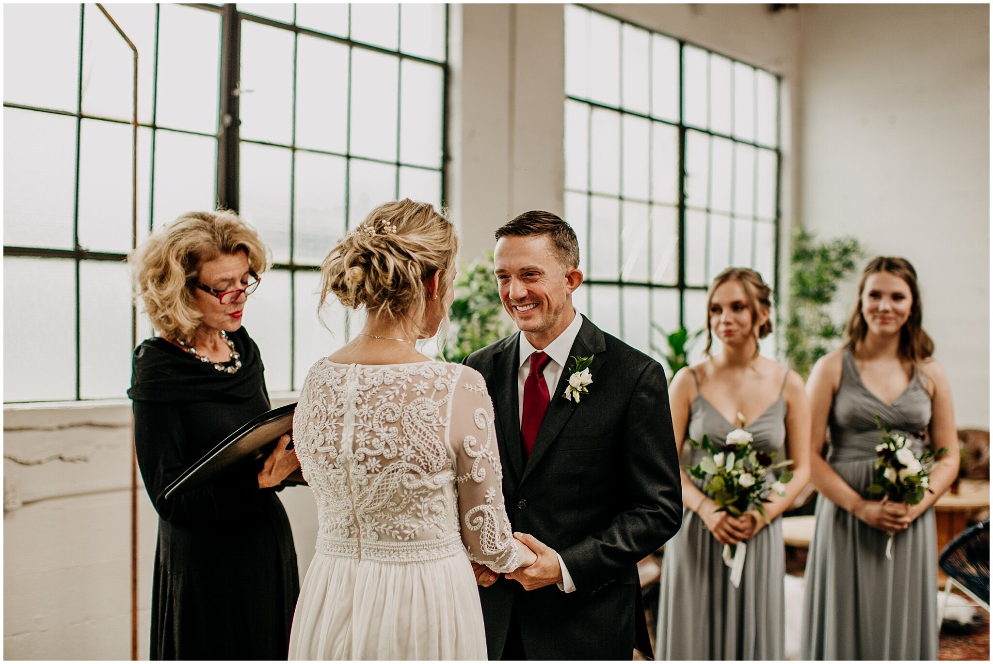 groom's candid reaction at settlement building wedding