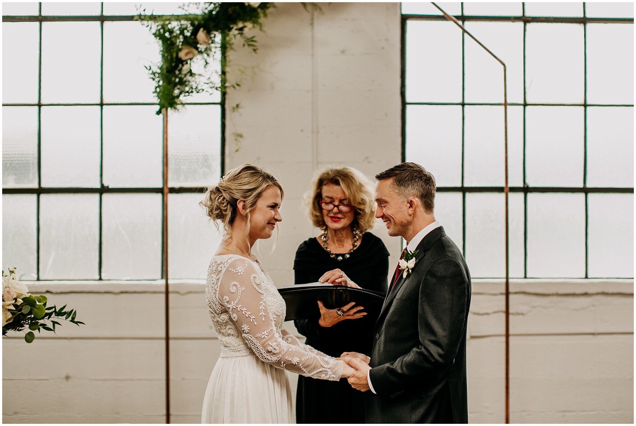 bride and groom at altar settlement building wedding