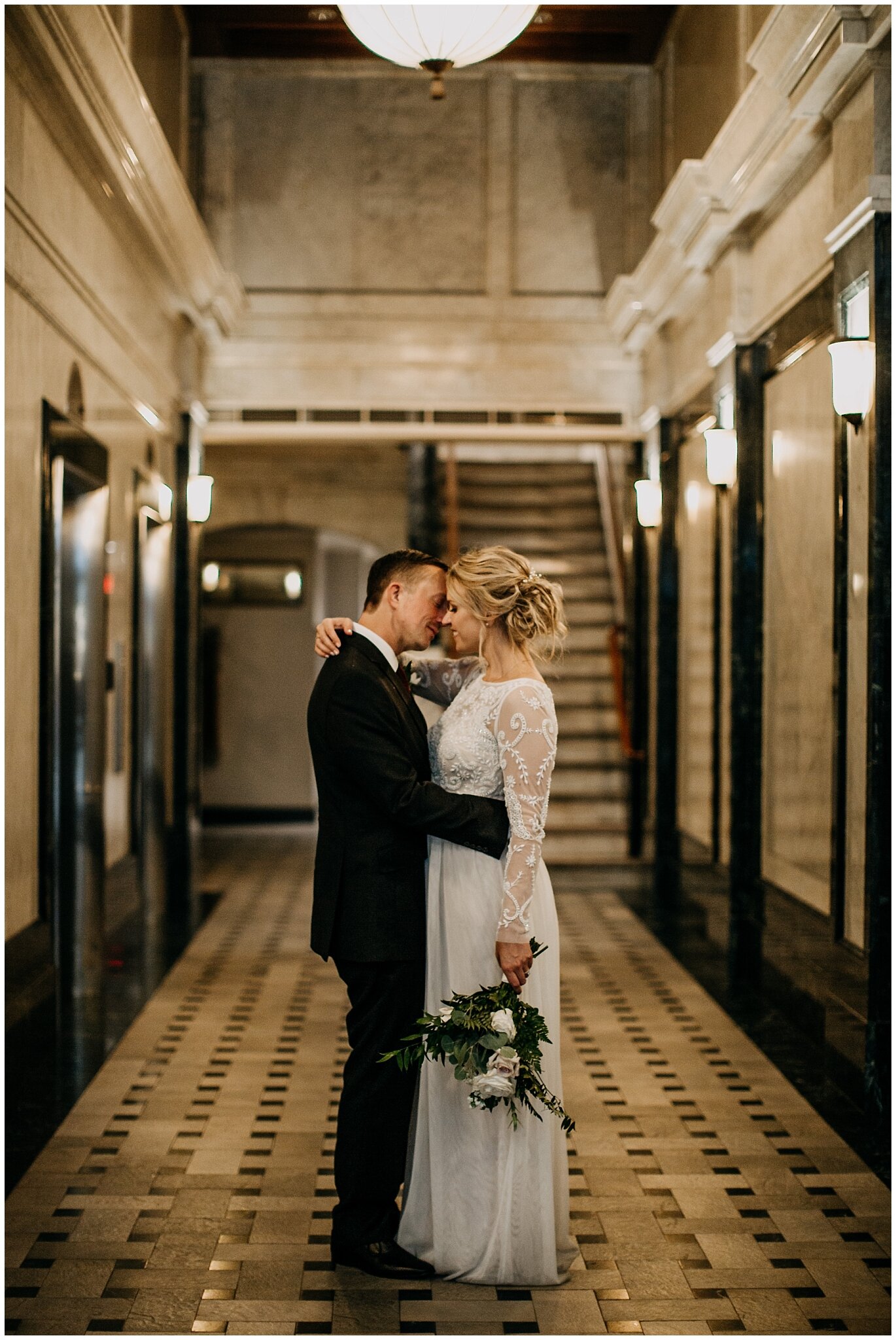 bride and groom portrait in vancouver block building